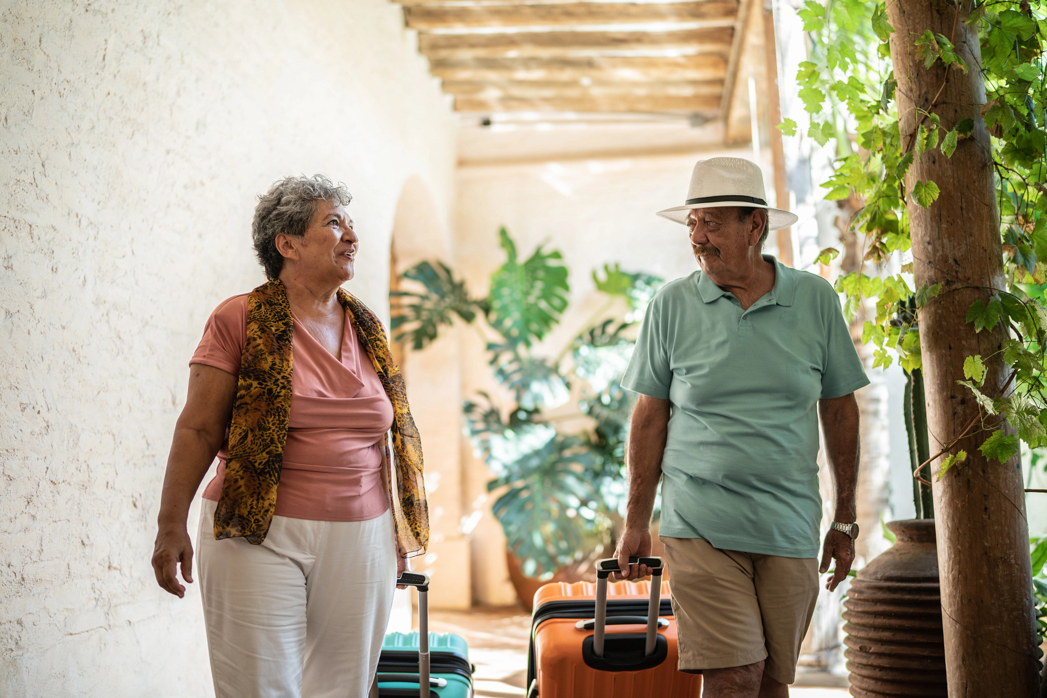 Senior couple talking while arriving to lodging