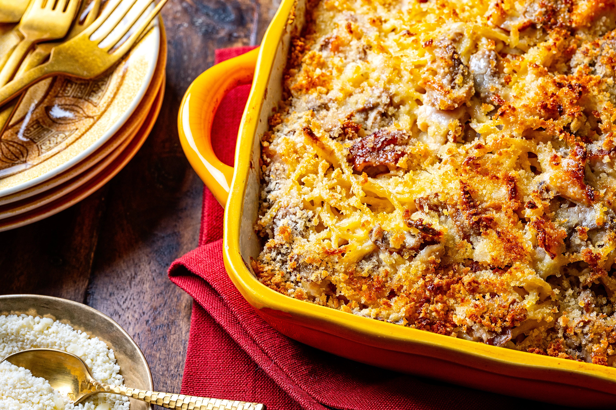 a photo shows turkey tetrazzini in a yellow casserole dish