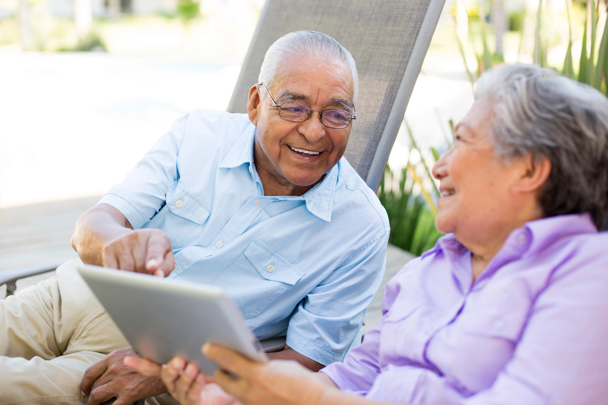 two people looking at a tablet