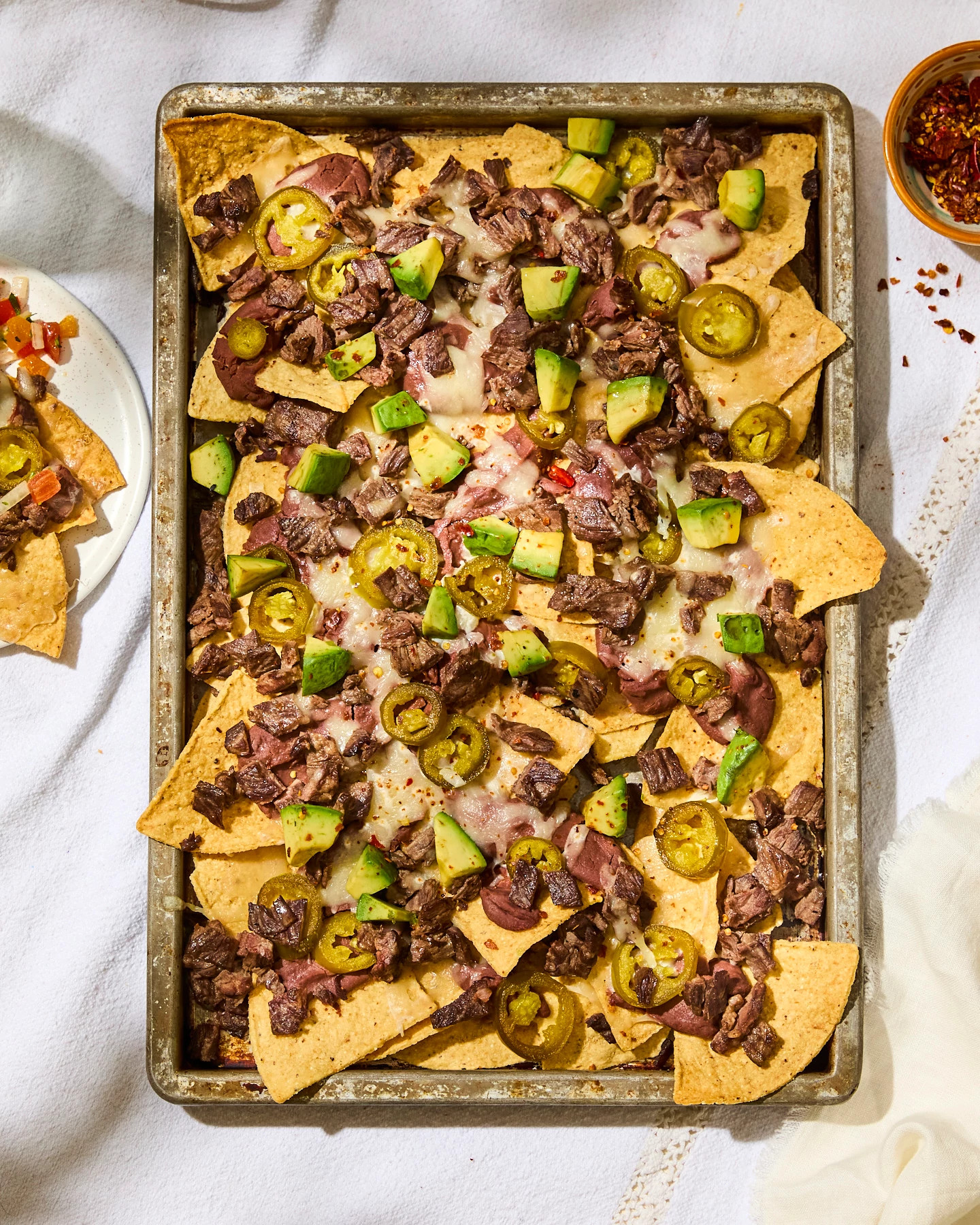 A photo shows Skirt Steak Nachos
