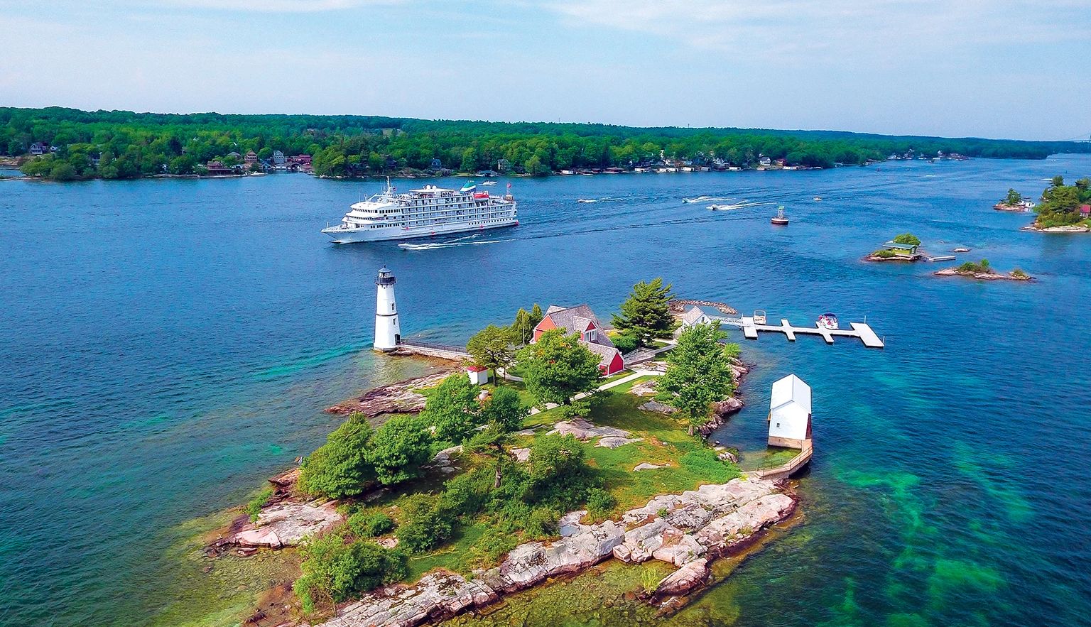 Great Lakes Cruises a cruise ship on the lake with a light house