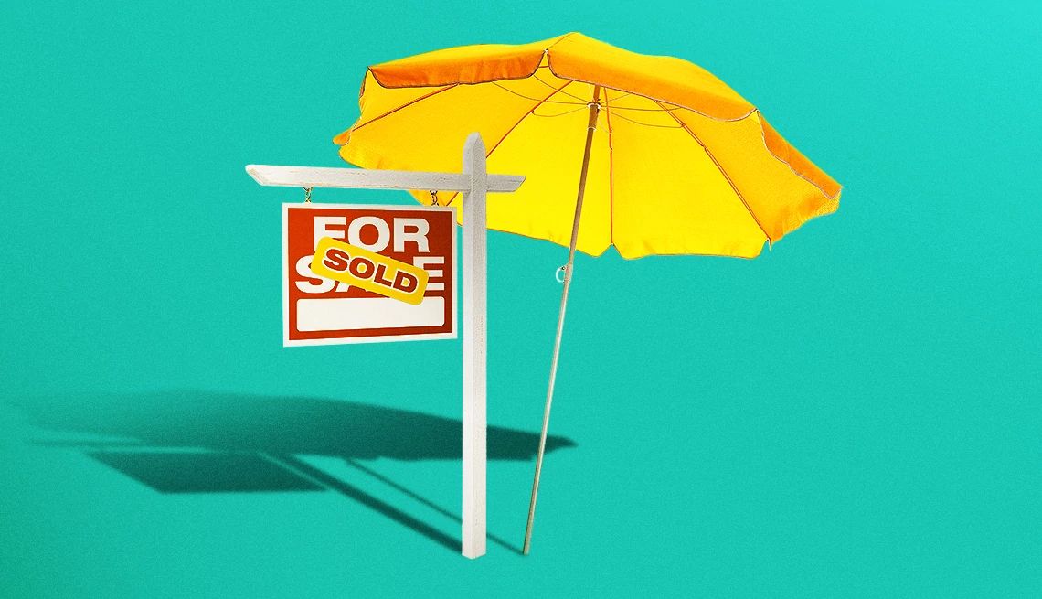 Guide to Buying a Vacation Home a for sale sign with a yellow umbrella