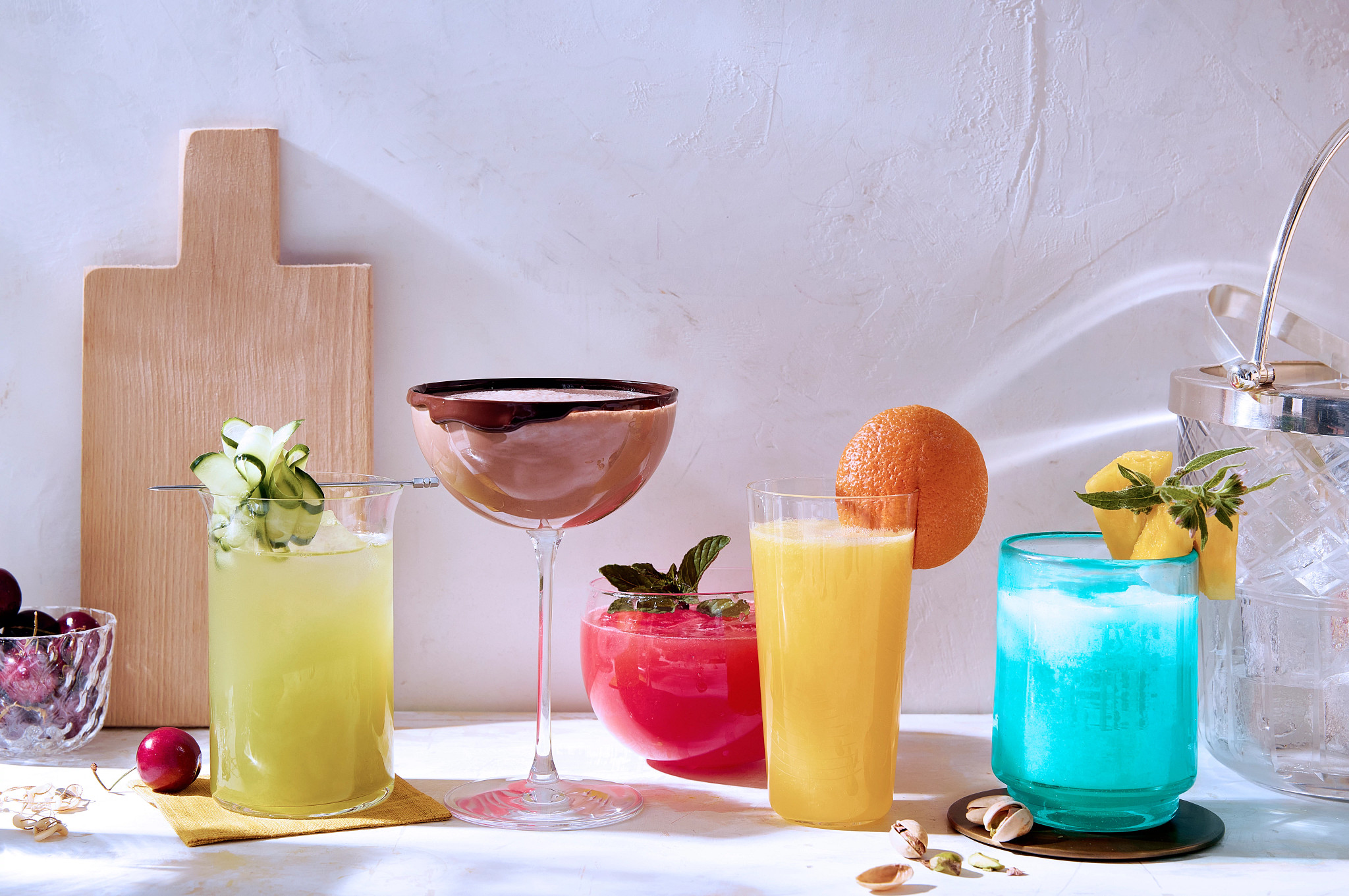 a photo shows Cucumber Spritz, Easy Chocolate, Watermelon Mocktail, Faux Mimosa and Blue Hawaii mocktails