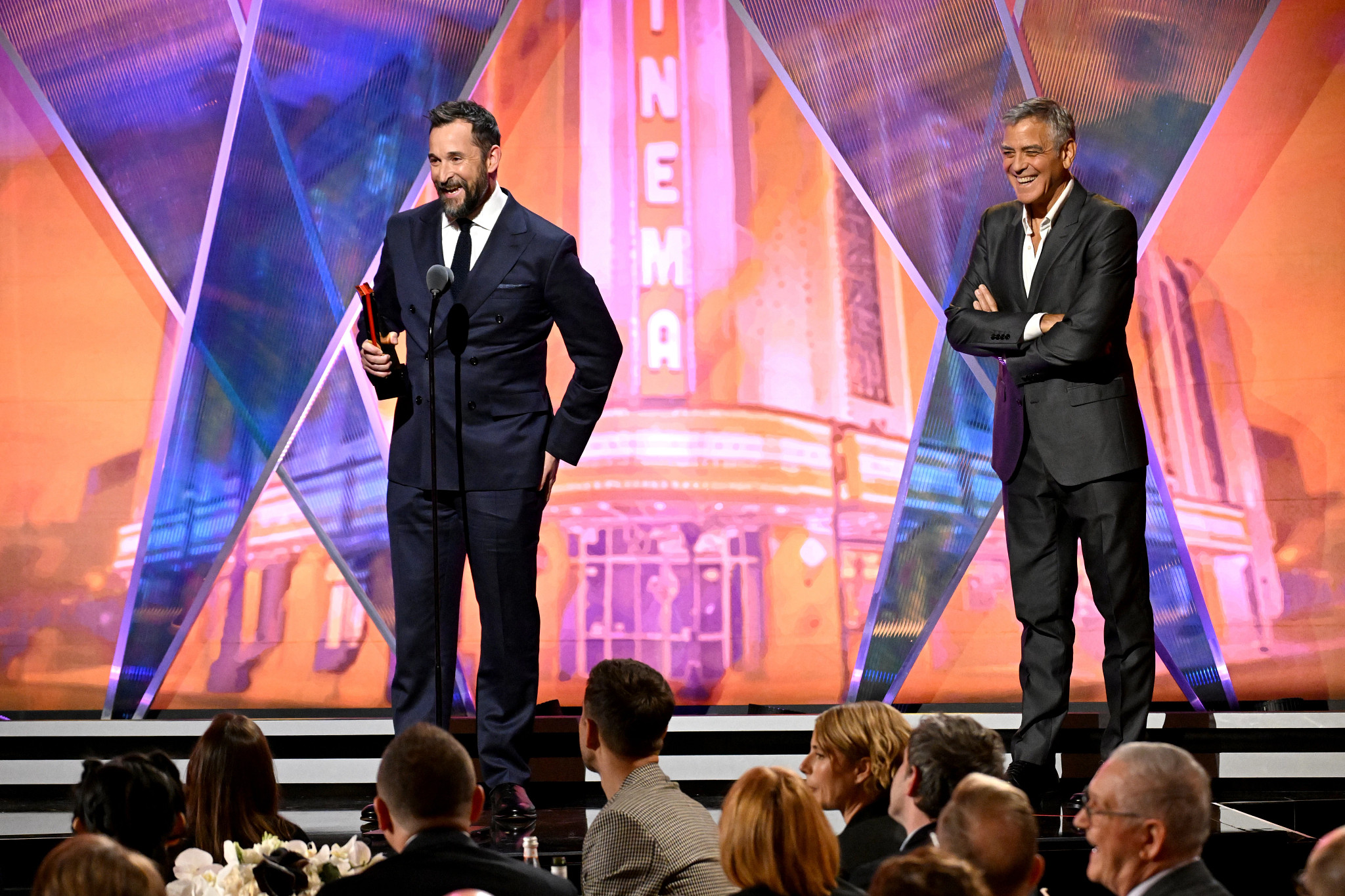 Noah Wyle and George Clooney onstage at AARP's Movies for Grownups Awards