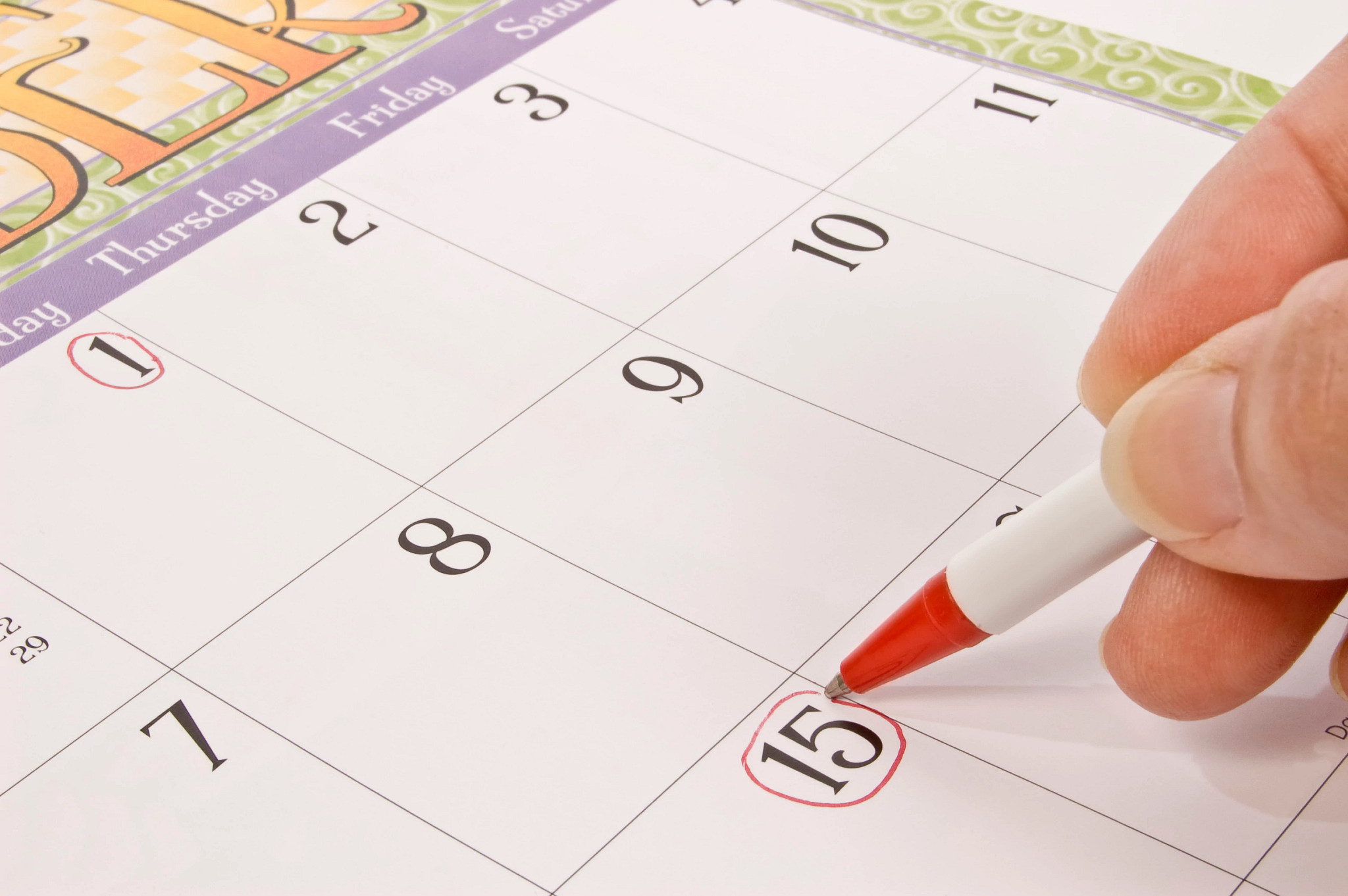 a person marking a calendar