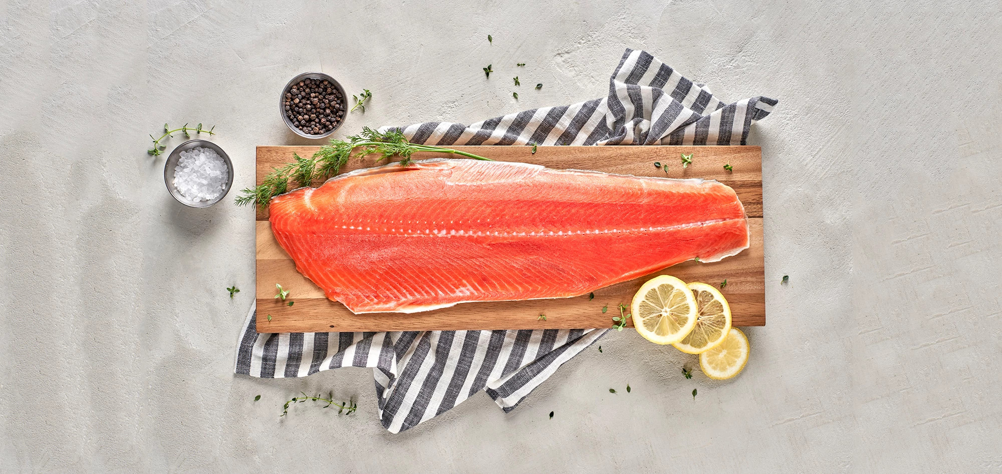 salmon filet on wooden slab shown for brain food