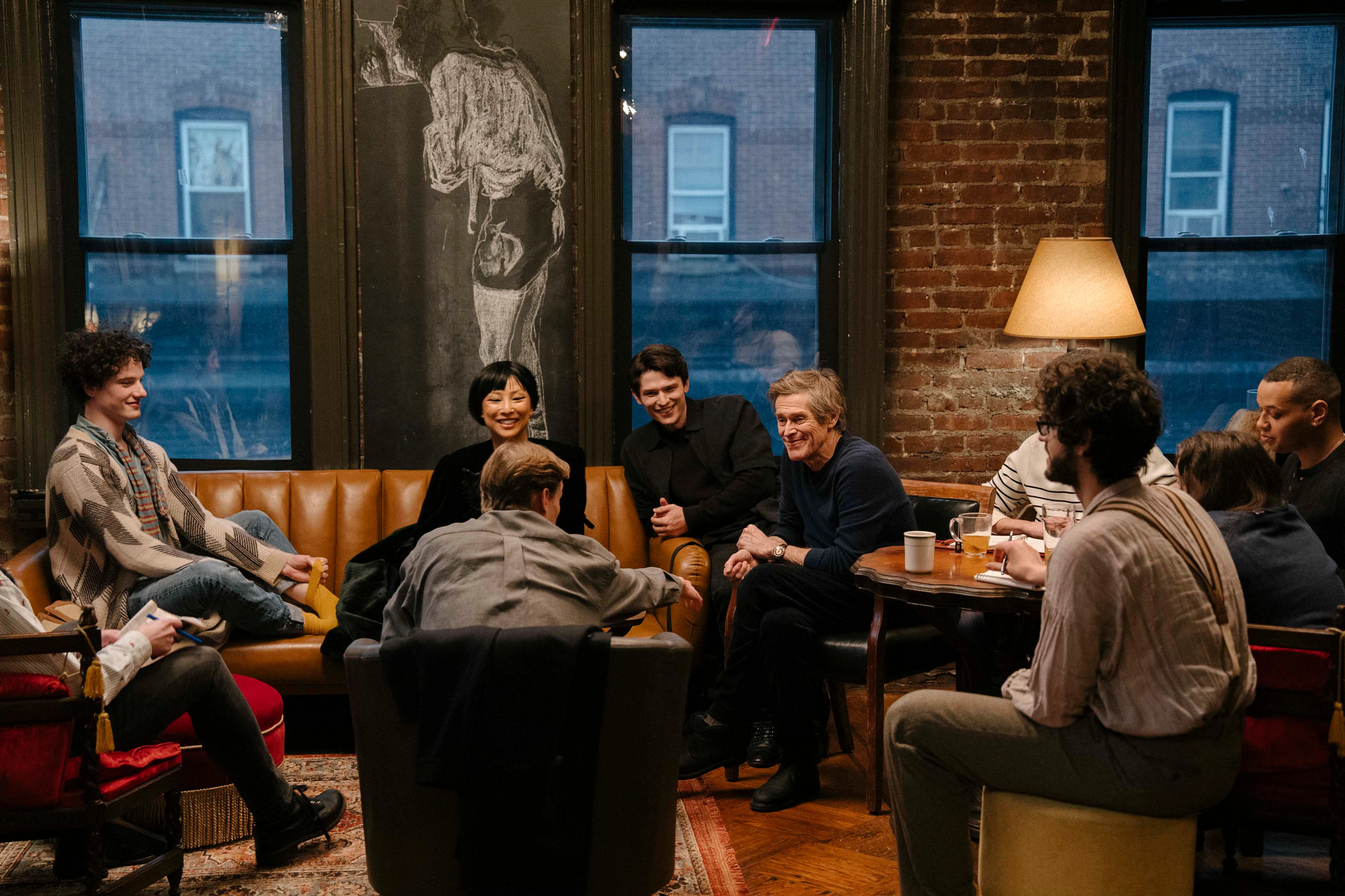 willem dafoe, greta lee and others in a scene from late fame