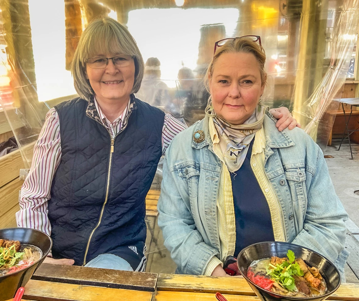 A photo shows sisters Joy Underhill (on the left) and Ginny Martinez, in Queens, New York in March 2021. The photo was taken the day Joy donated stem cells for Ginny’s bone marrow transplant.