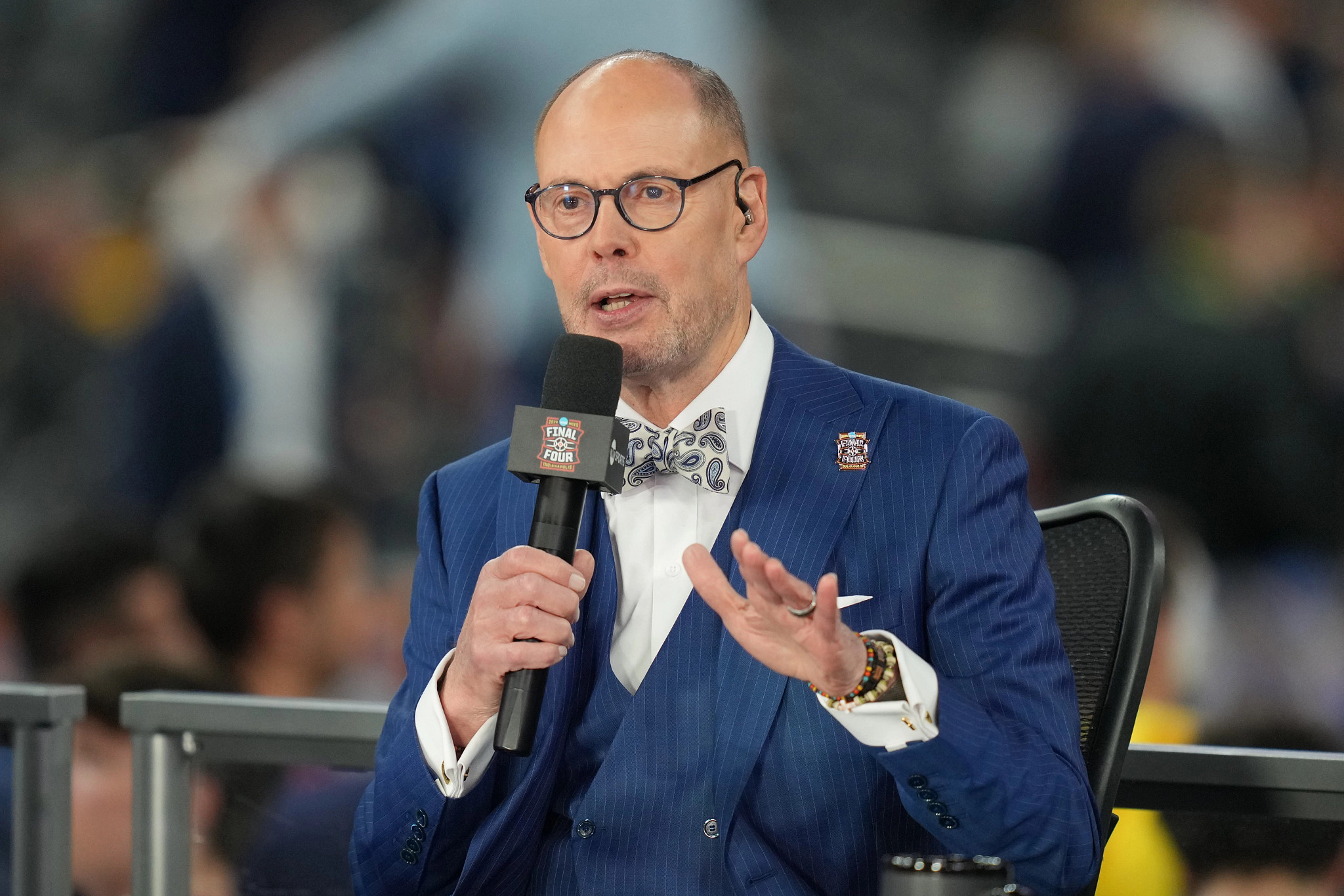 Ernie Johnson speaking into a microphone