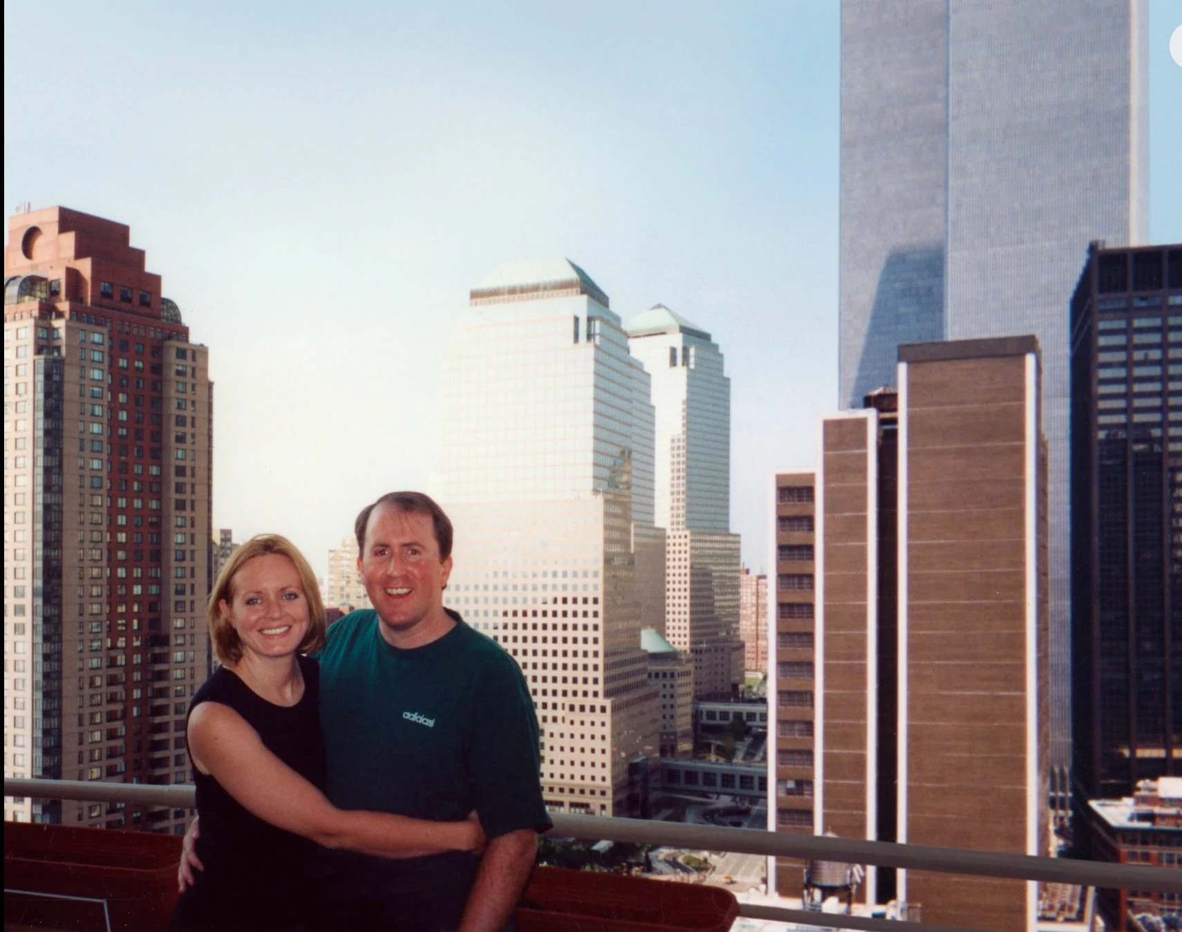 stanton and her husband take a photo from their apartment balcony