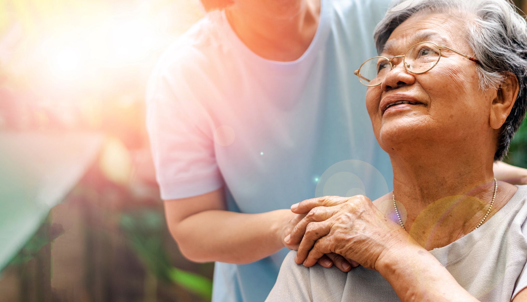 caregiver holding care recipient's hand caregiver holding care recipient's hand