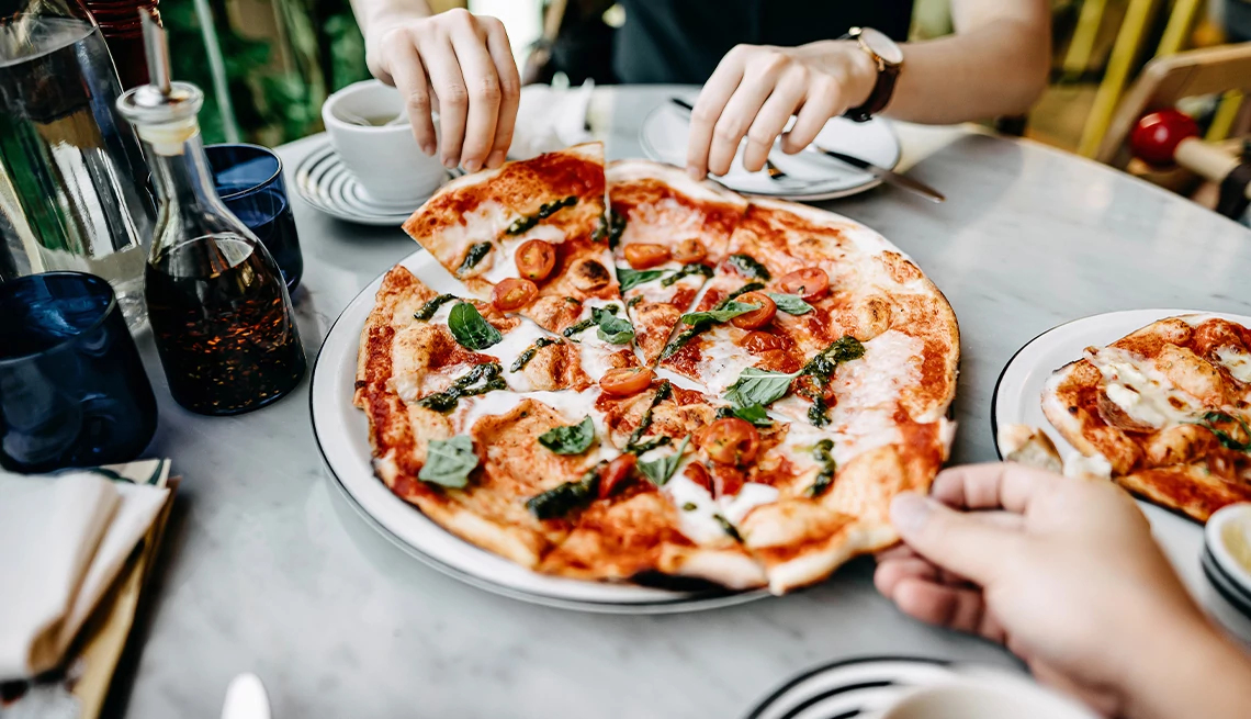 Brick oven pizza on restaurant table
