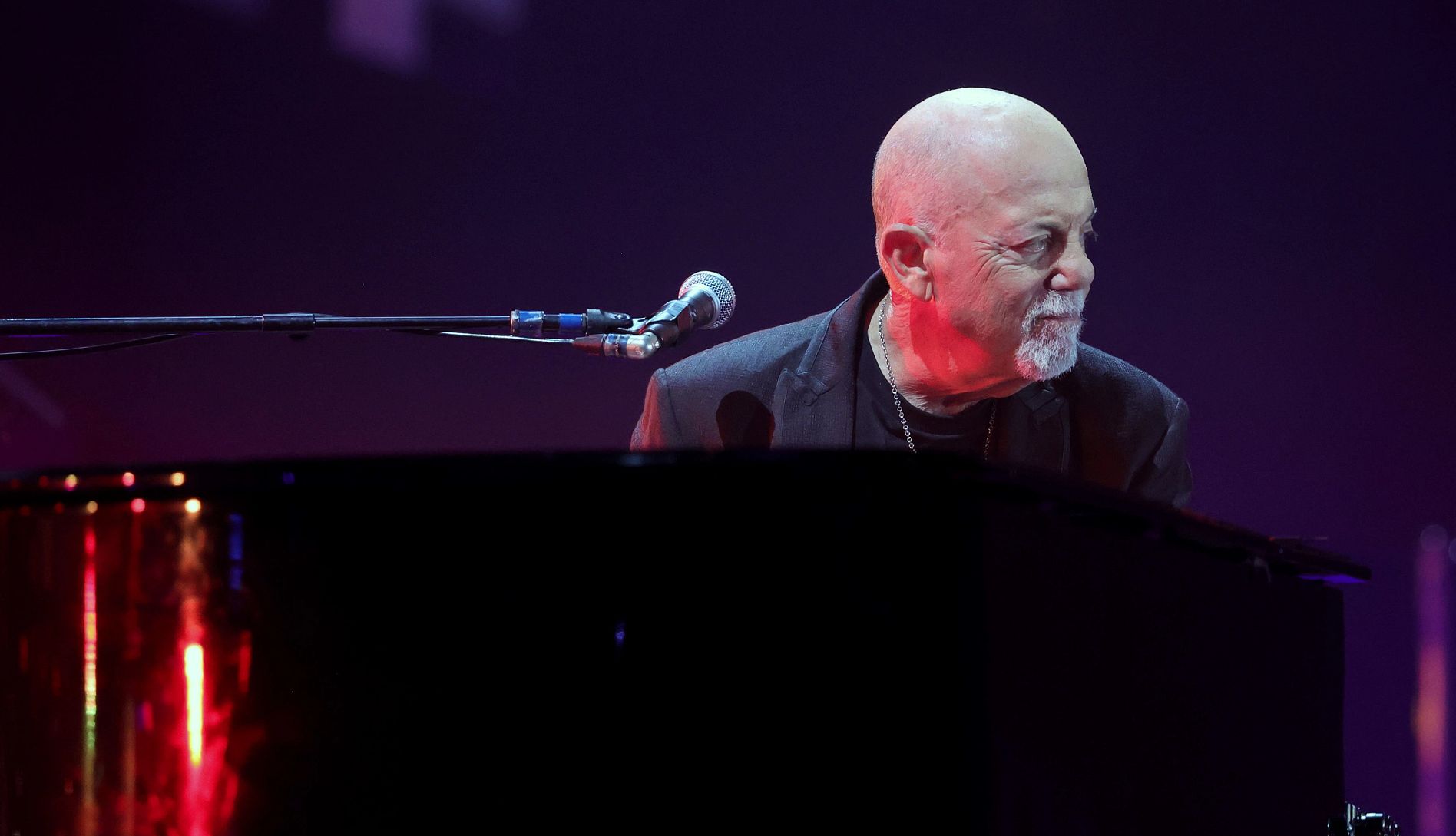 Billy Joel on Brain Diagnosis billy joel playing a piano onstage