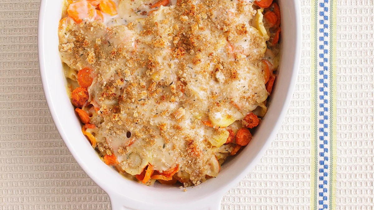 A close-up view of carrot-parsnip gratin in a bowl