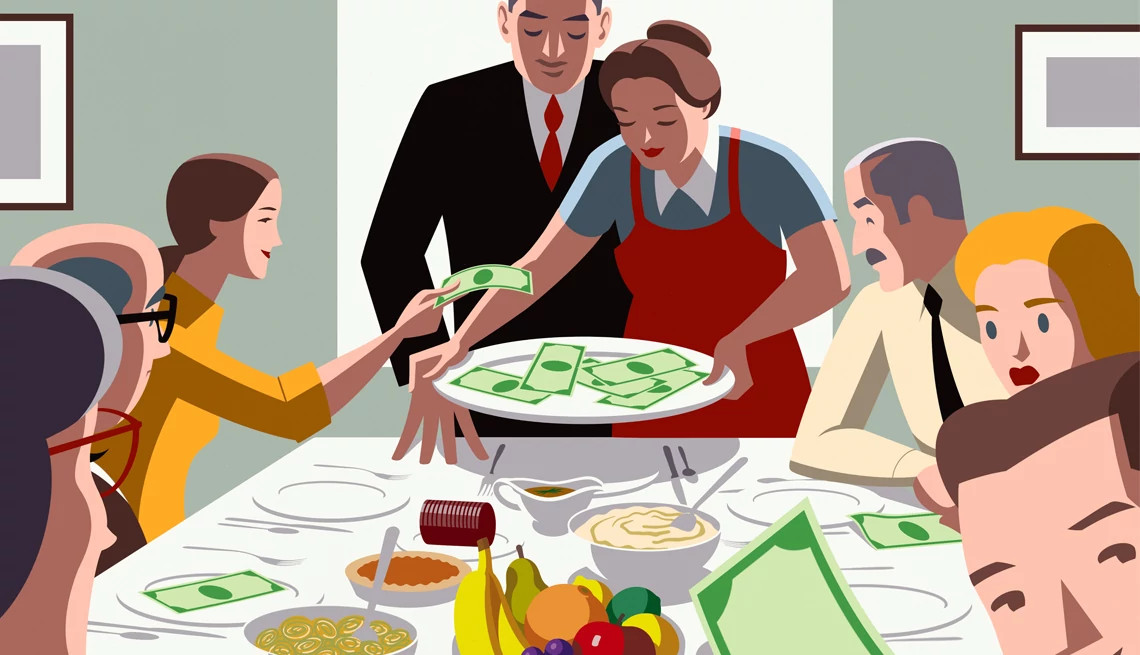 diners around a table put cash onto a serving tray held by a woman at the head of the table