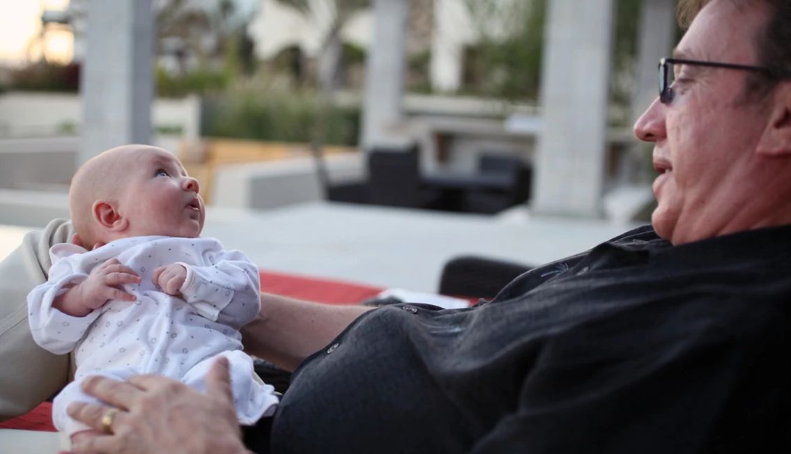 Tim Allen’s Dad Guide A photo shows Tim Allen holding his daughter, Elizabeth, as a baby