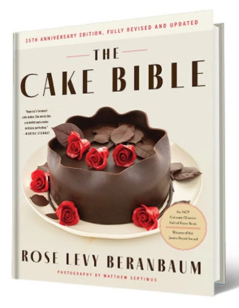 Book that says The Cake Bible, Rose Levy Beranbaum; picture of chocolate cake with roses on it on cover