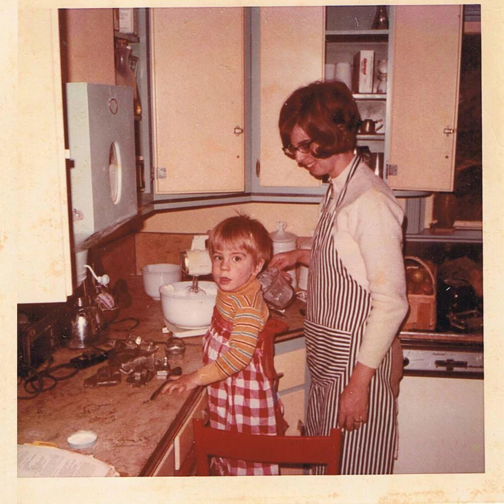 a photo shows writer eric spitznagel as a child in the kitchen with his mother