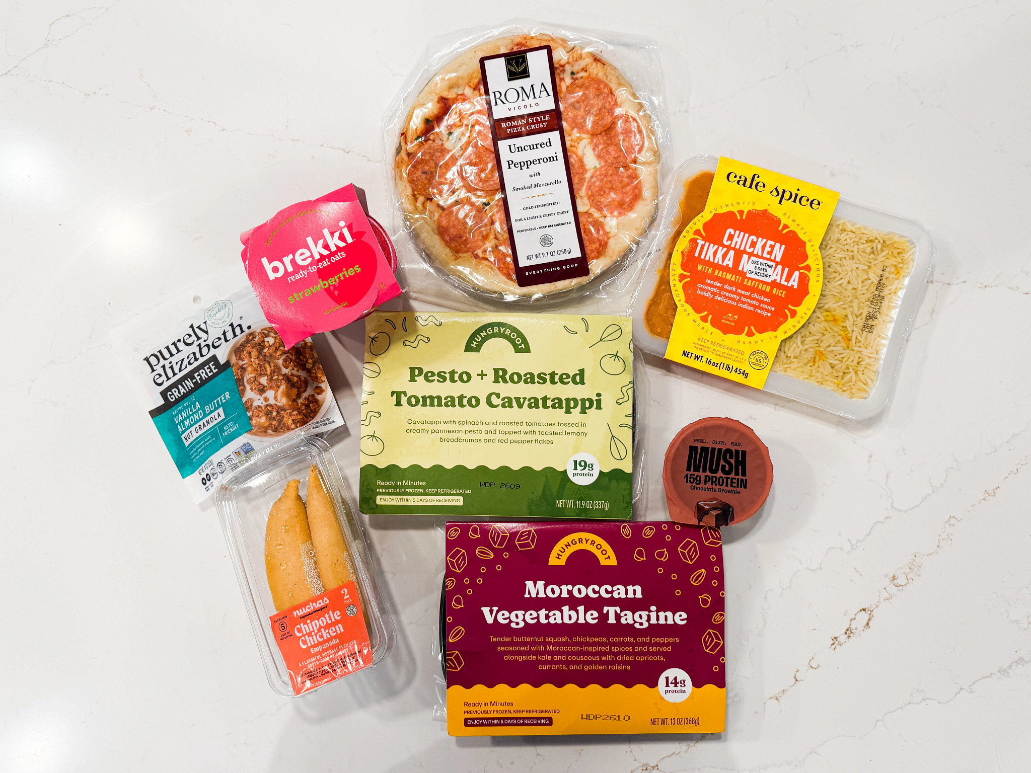 Prepared meals and snacks from Hungryroot displayed on a kitchen counter