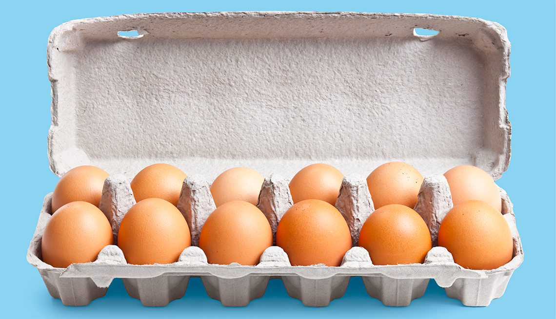 Cage-Free Egg Recall Organic eggs in cartons tray on blue background