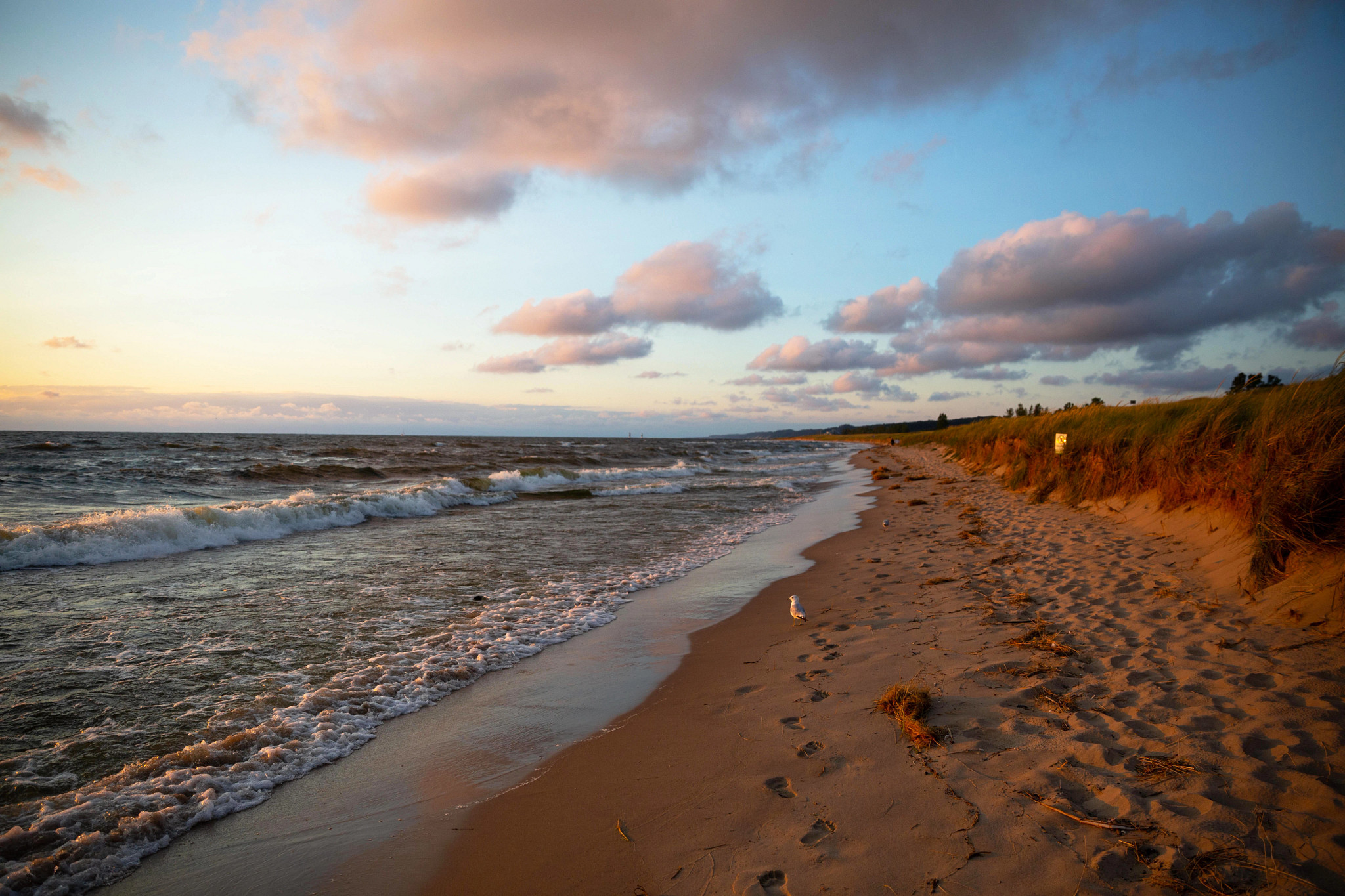 an empty beach at sunrise