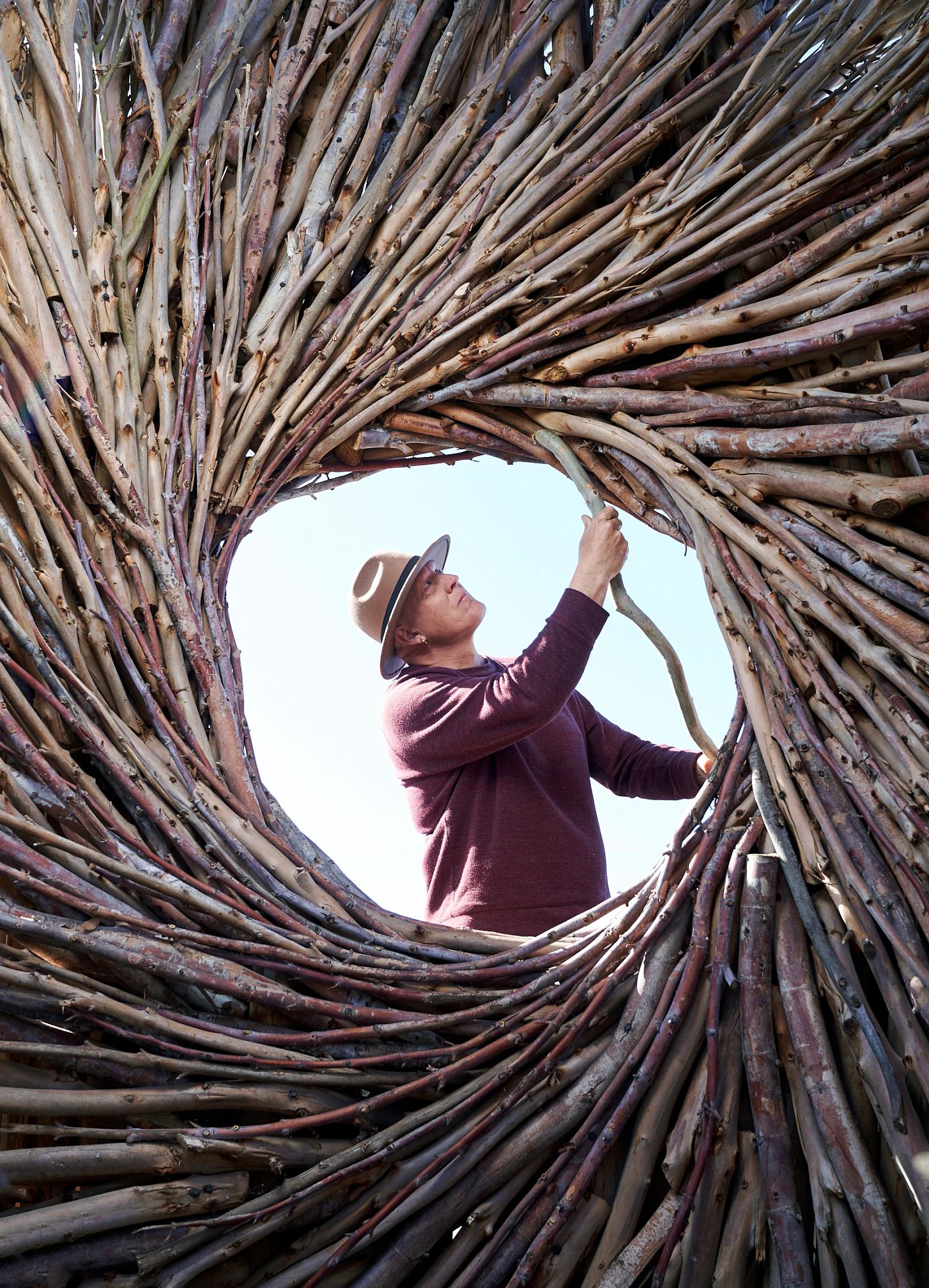 Best AARP Photos of 2024 a bunch of sticks of wood turned into a circle with a man in the middle
