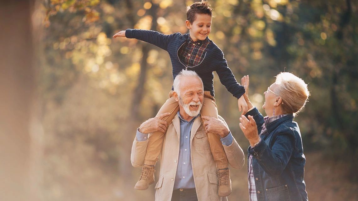 Grandparents playing with grandson