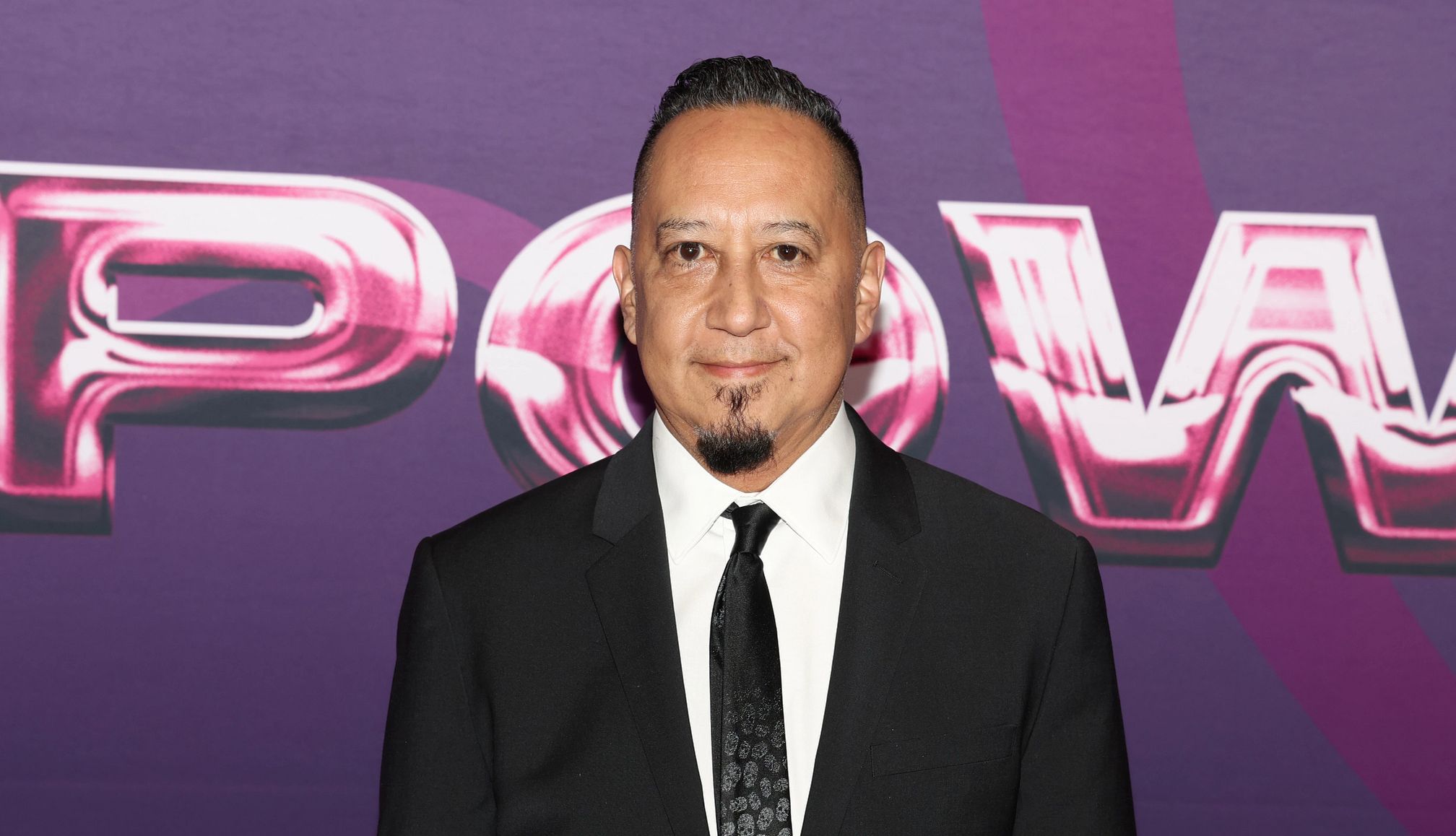 Cleto Escobedo III, Jimmy Kimmel’s Bandleader, Dies Cleto escobedo smiles while wearing a suit and tie