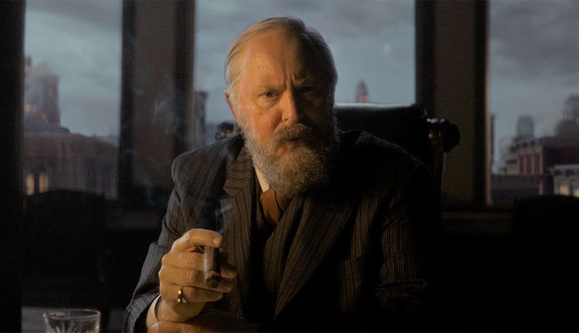 John Lithgow holding a cigar in the film "Cabrini"