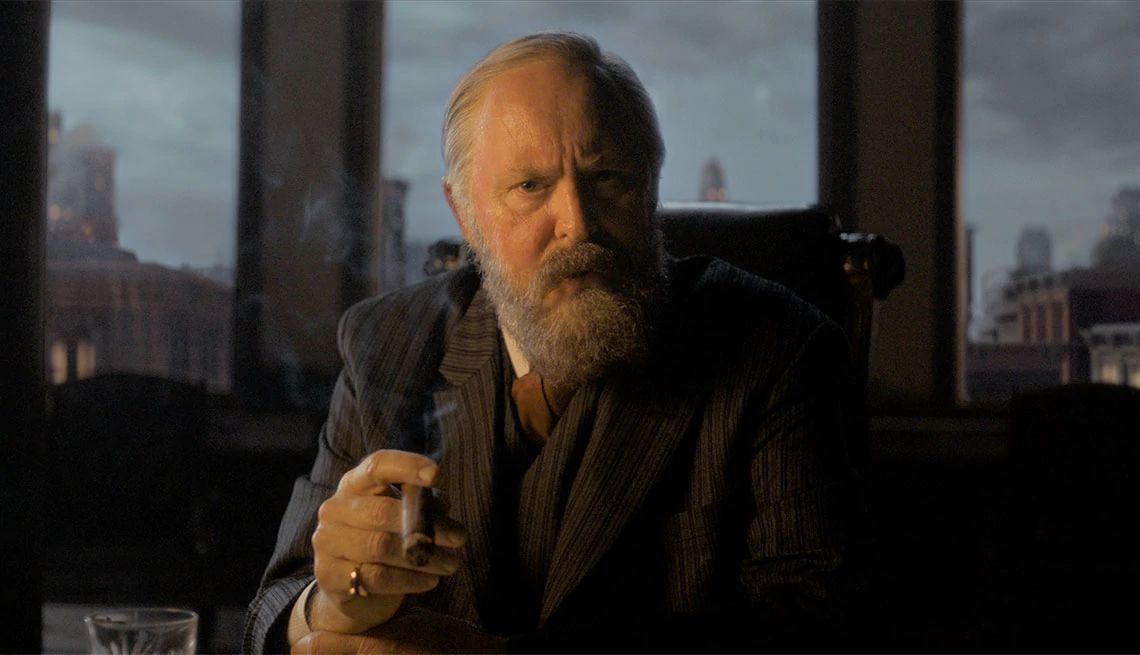 John Lithgow holding a cigar in the film "Cabrini" John Lithgow holding a cigar in the film "Cabrini"