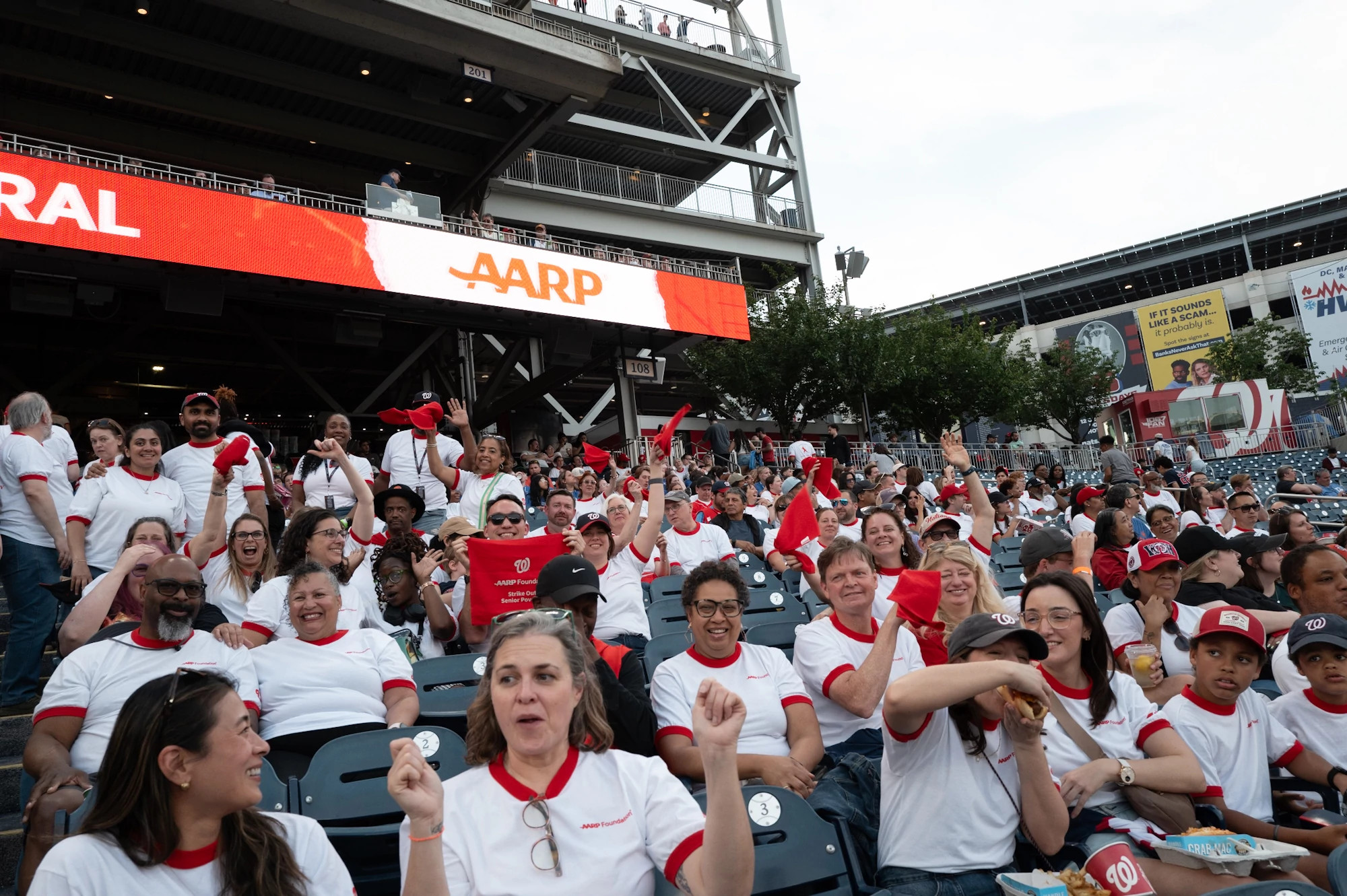 a photo shows AARP Foundation members at the Nationals-Twins game