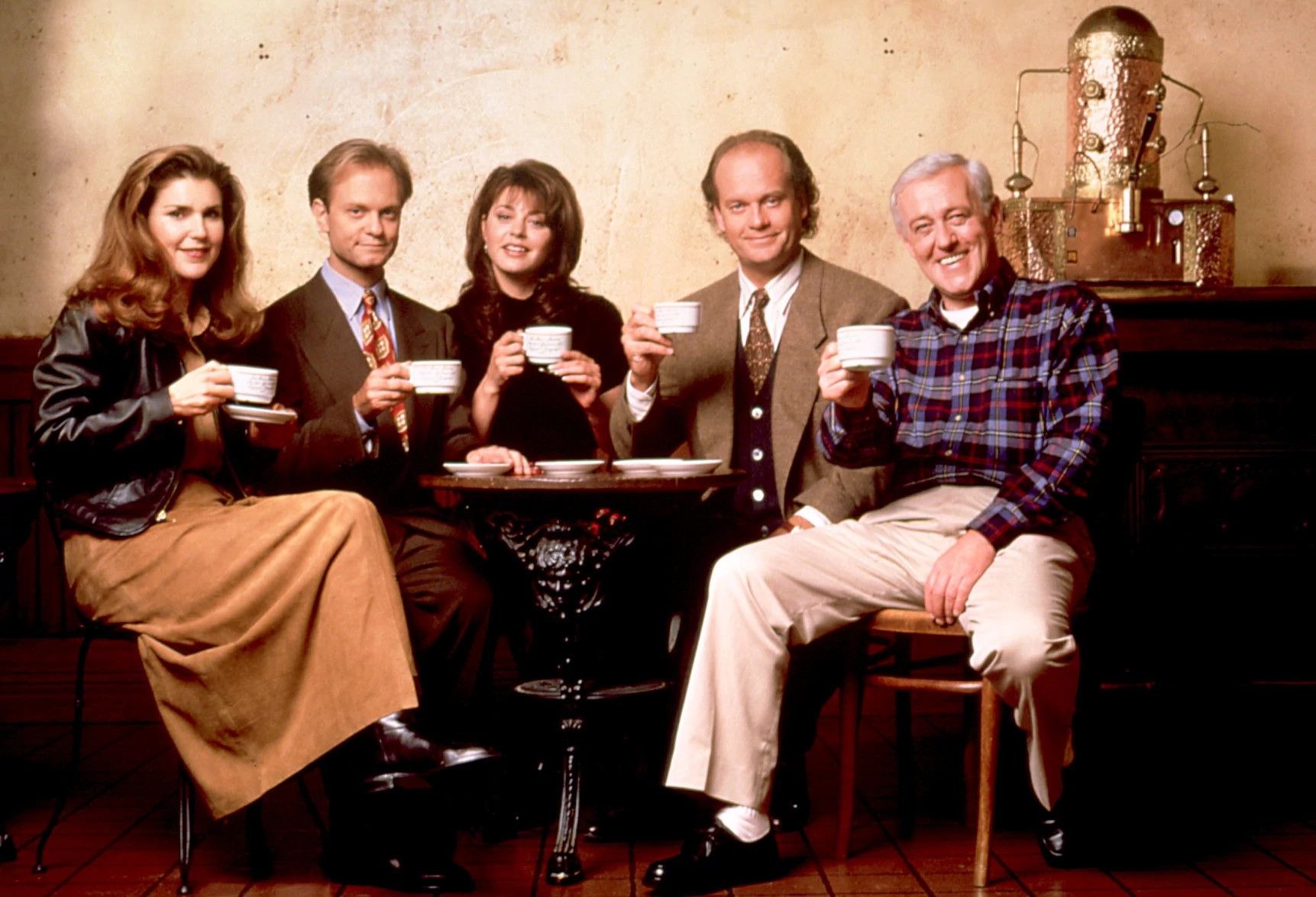 the cast of frasier sitting at a table