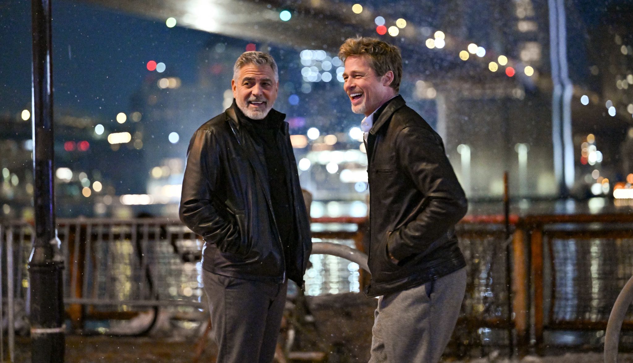 George Clooney and Brad Pitt George Clooney and Brad Pitt on the set of "Wolfs" at the South Street Seaport on February 14, 2023 in New York City