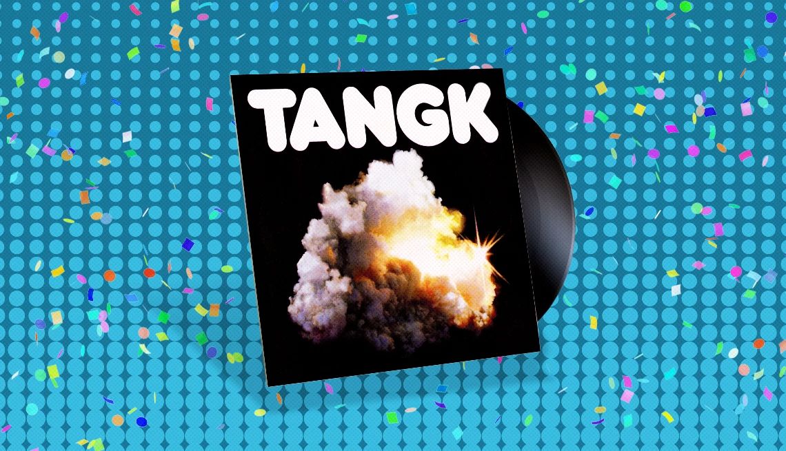 IDLES’ “Tangk" Album cover with record sticking out of it and the word Tangk above explosion on cover; blue background with confetti on it