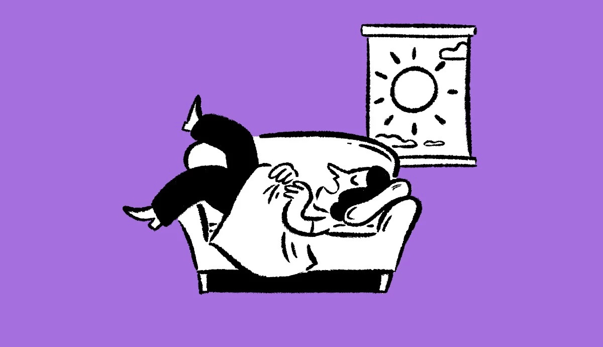 person lying awkwardly on a couch taking a daytime nap near a window