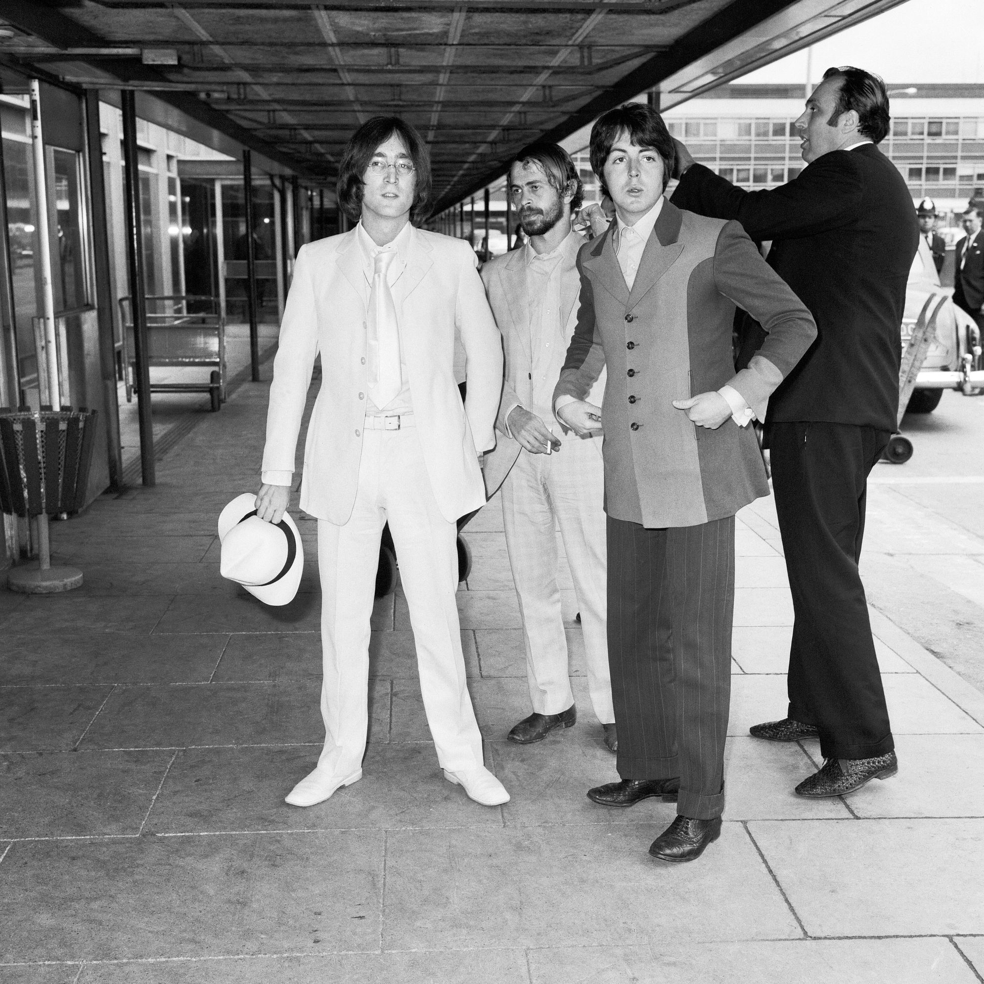 John Lennon, Alex Mardas and Paul McCartney at London Airport in 1968