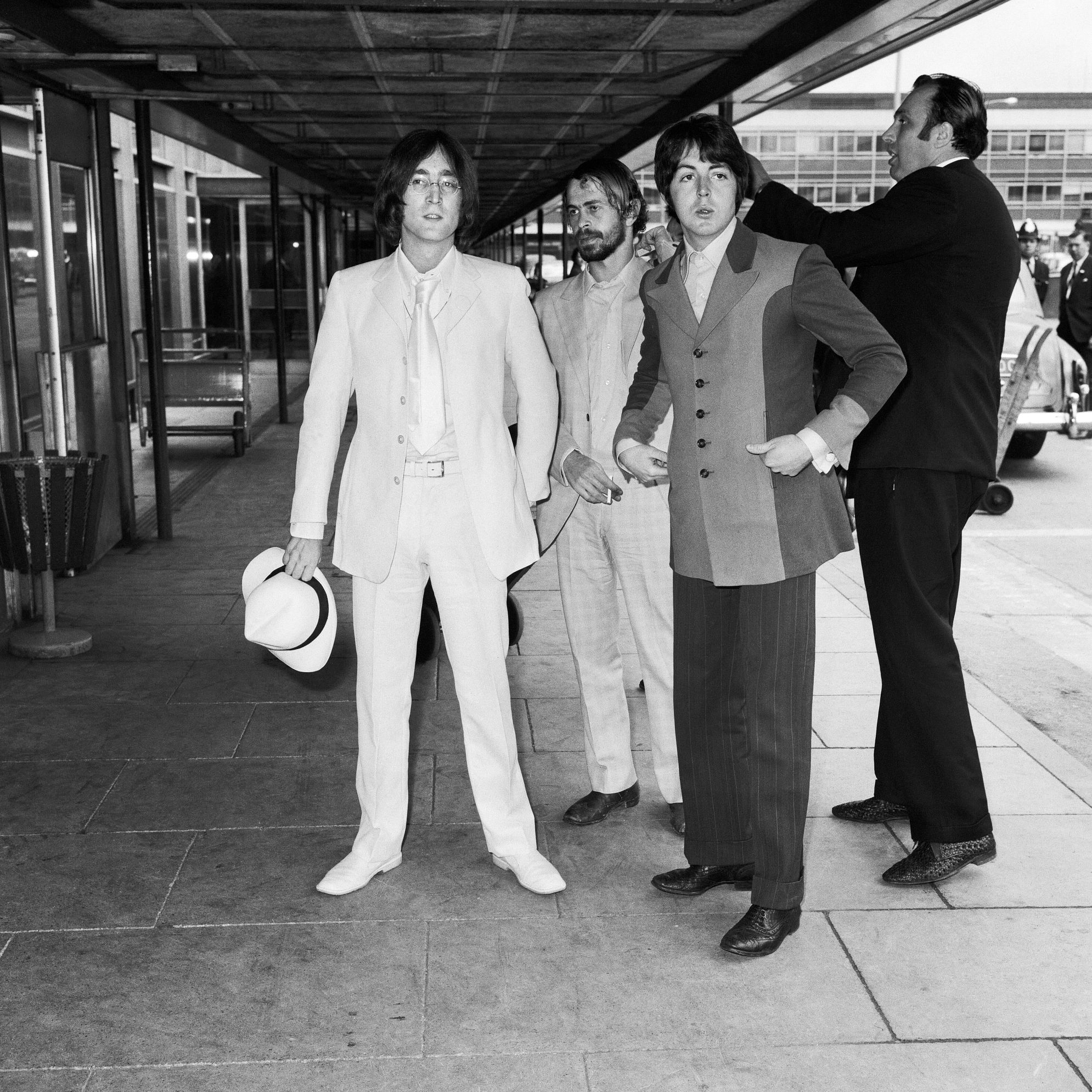 John Lennon, Alex Mardas and Paul McCartney at London Airport in 1968