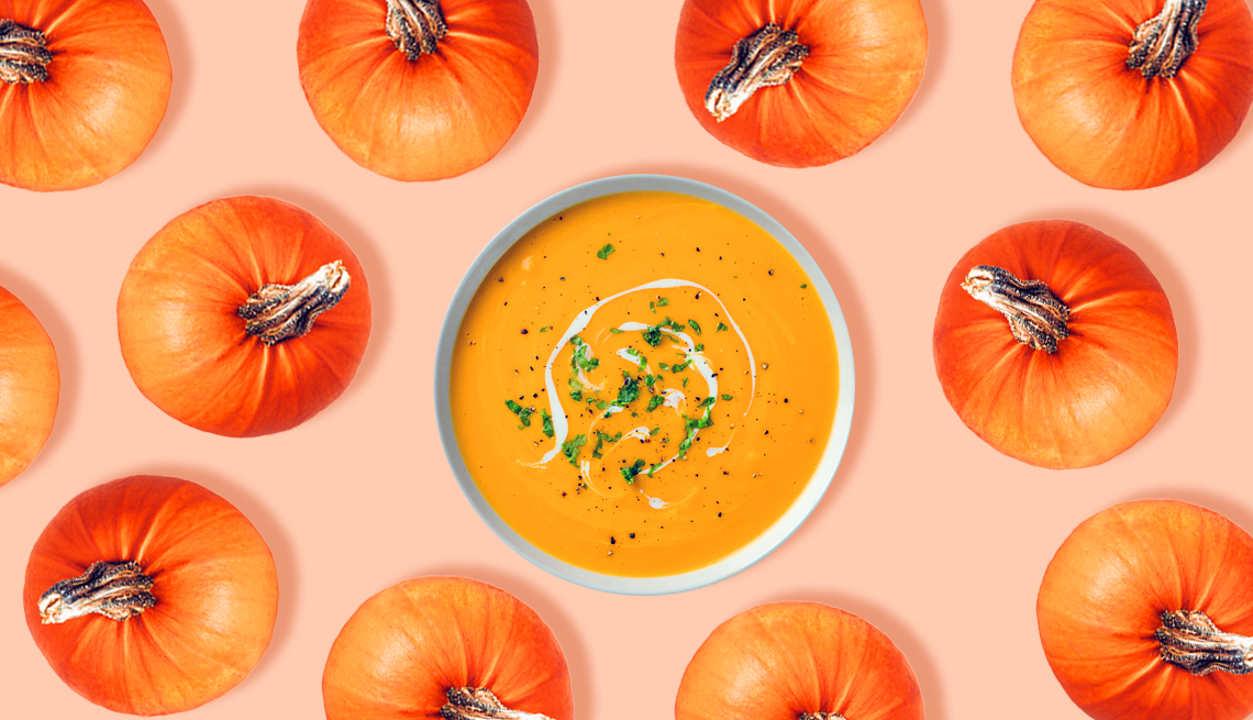 Pumpkins are Packed with Nutrients pumpkin soup surrounded by small orange pumpkins on a pink background