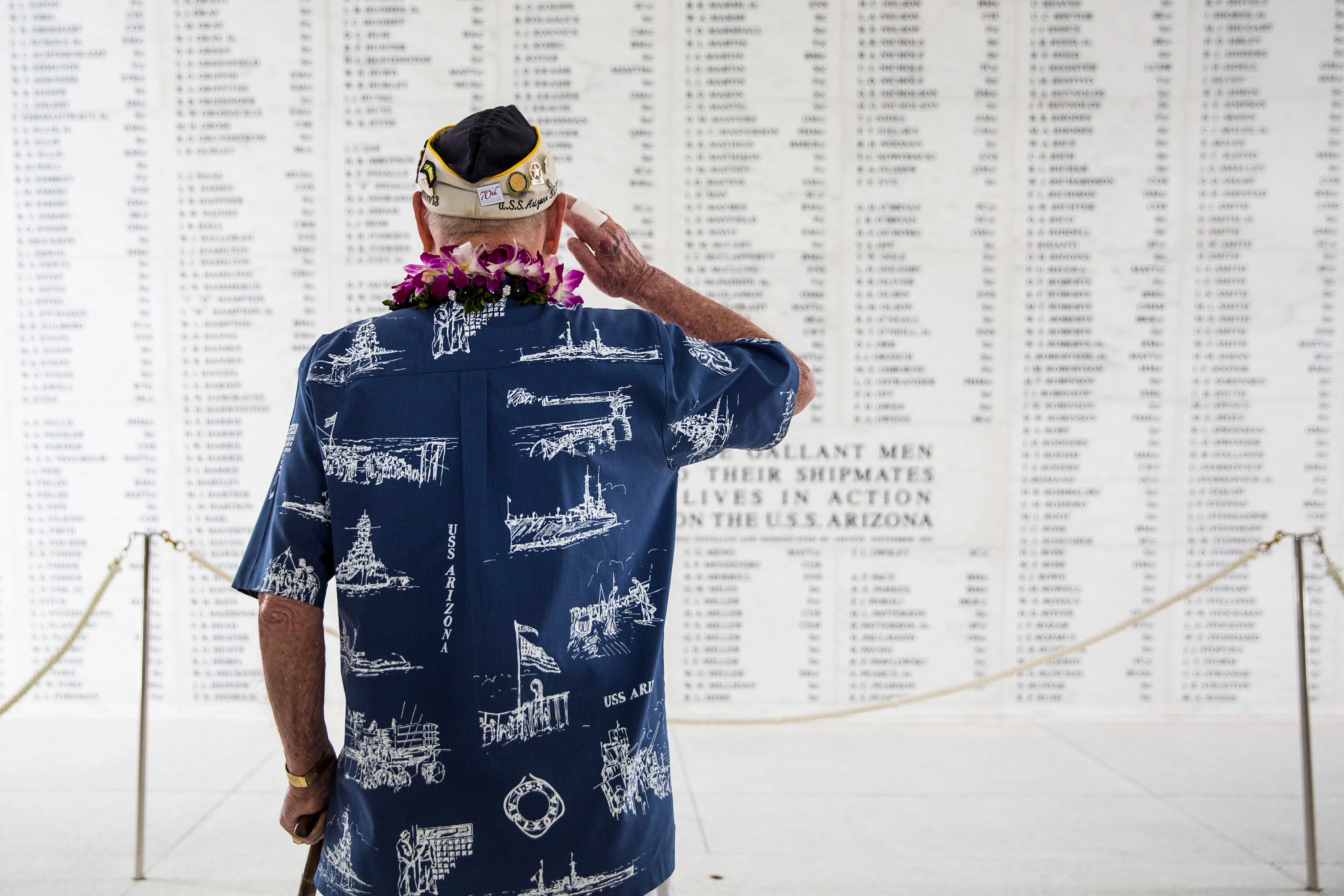 Lou Conter salutes a wall of names