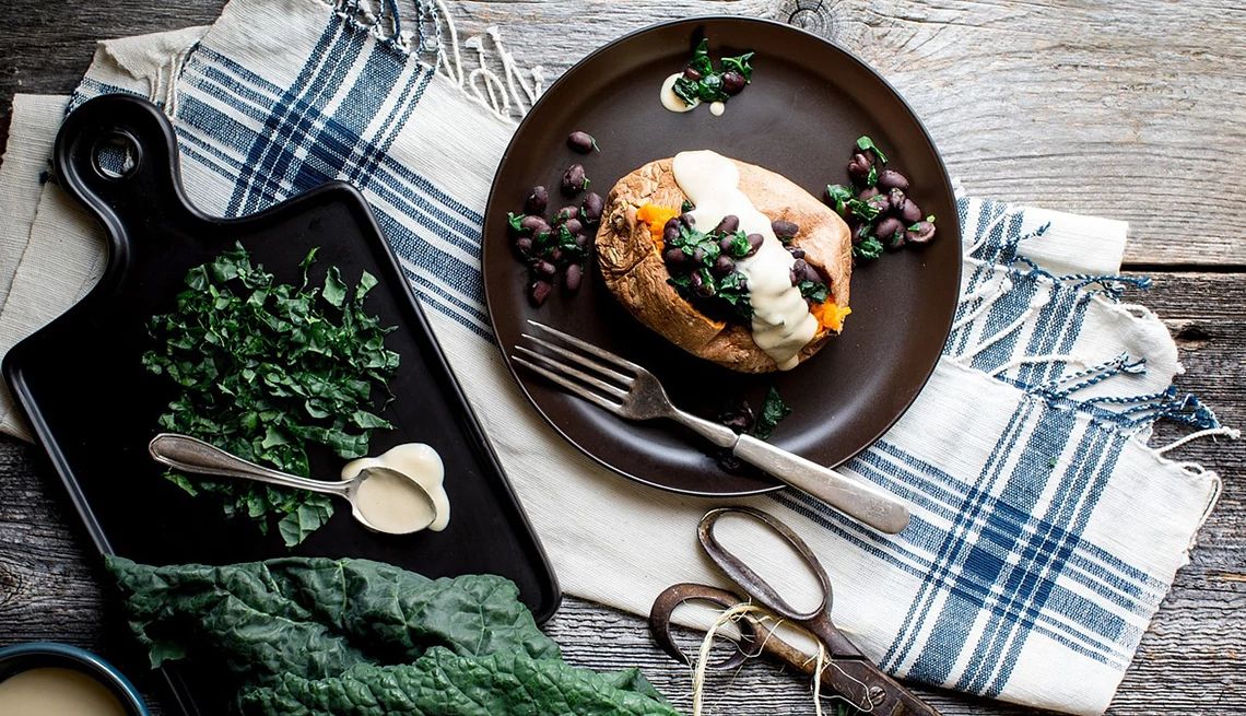 https://aarp.widen.net/content/pzd0pzmsz5/jpeg/1140-stuffed-sweet-potato.jpg?crop=true&anchor=0,0&q=80&color=ffffffff&u=xp0vsk&w=1140&h=655 https://aarp.widen.net/content/pzd0pzmsz5/jpeg/1140-stuffed-sweet-potato.jpg?crop=true&anchor=0,0&q=80&color=ffffffff&u=xp0vsk&w=1140&h=655