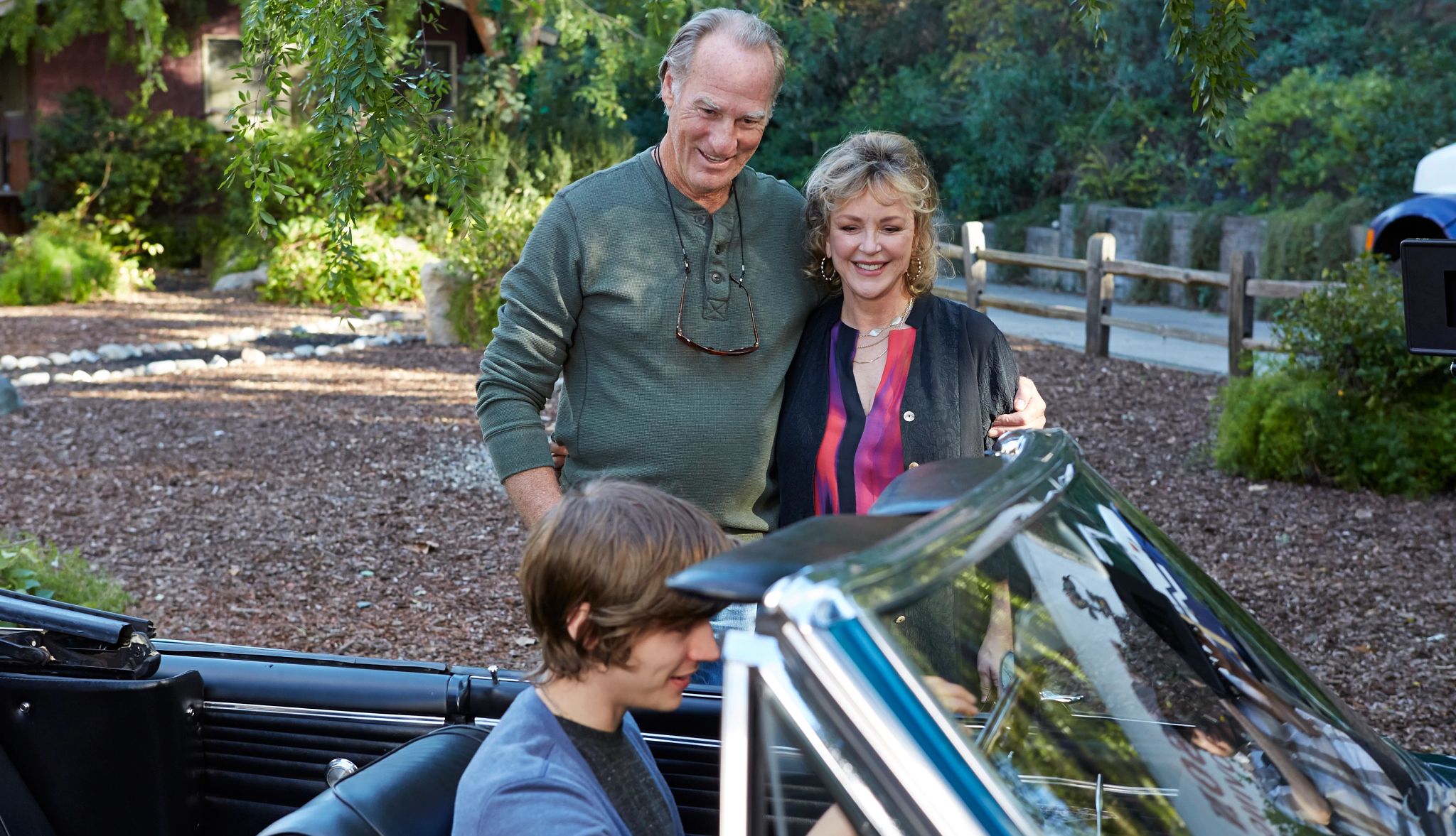 Craig T. Nelson starred in 'Parenthood' Miles Heizer in car, Craig T Nelson and Bonnie Bedelia standing outside of car in a still from Parenthood