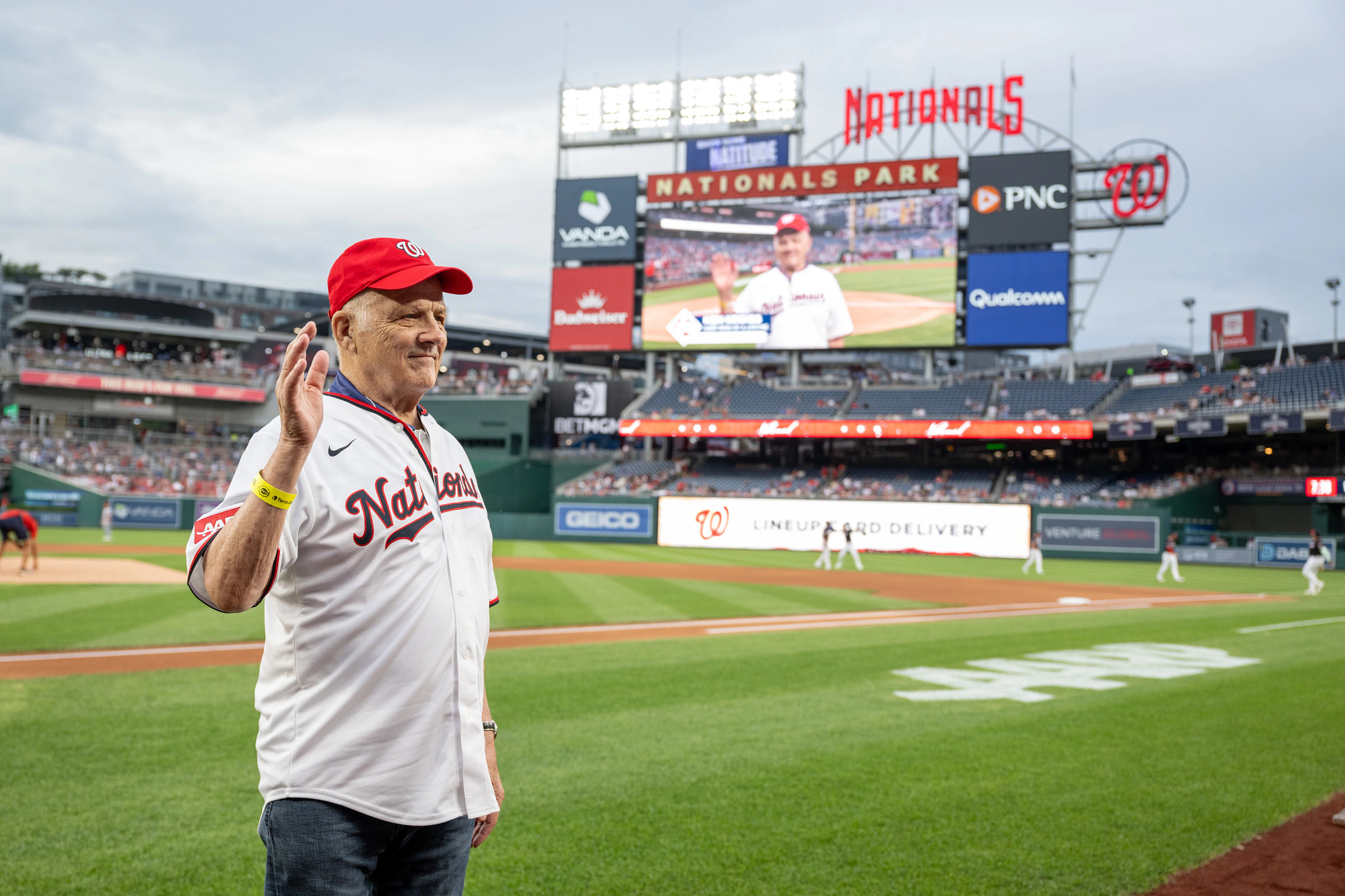 Ken Kroiss waving from the field at Nationals Stadium.