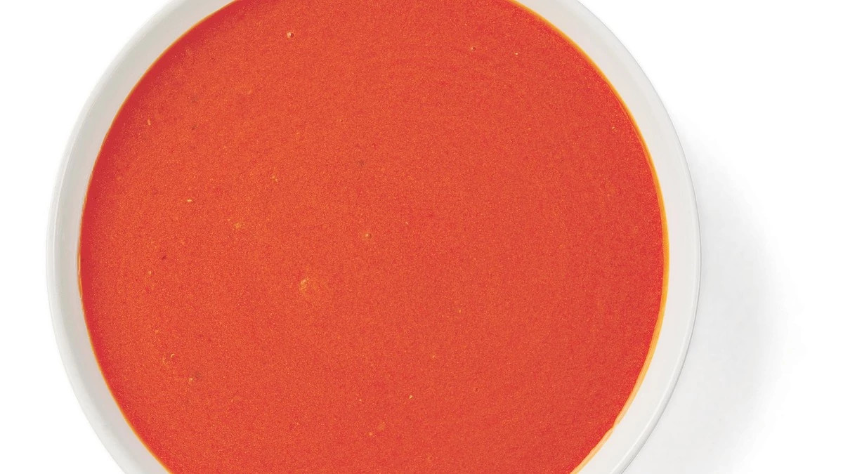 A close-up view of tomato soup in a bowl
