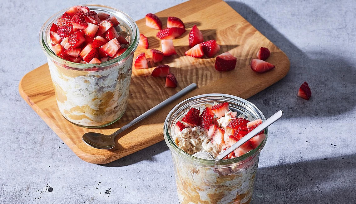 A close-up view of high-protein strawberry and peanut butter overnight oats in cups