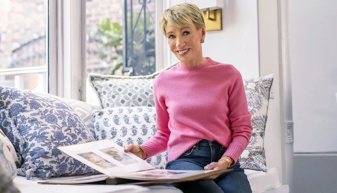 barbara corcoran talks about caring for her mom with alzheimer's barbara corcoran poses on a couch with a photo album