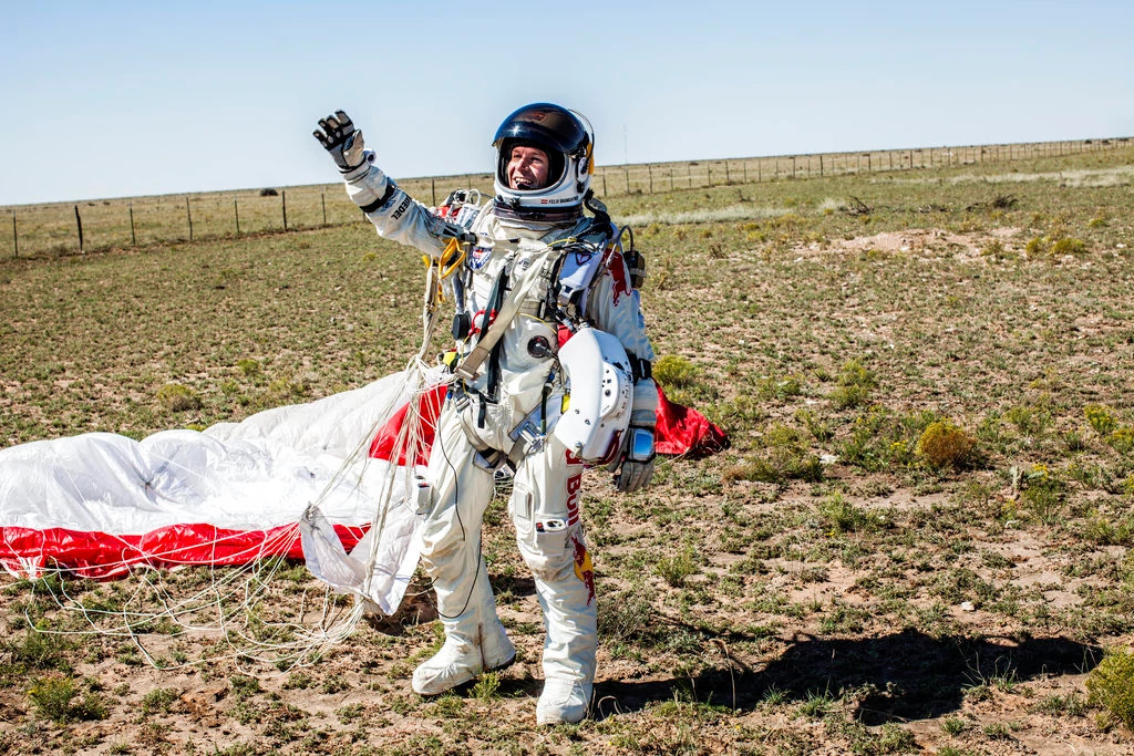Skydiver Felix Baumgartner Dies Felix Baumgartner in a spacesuit and parachute walking on the ground