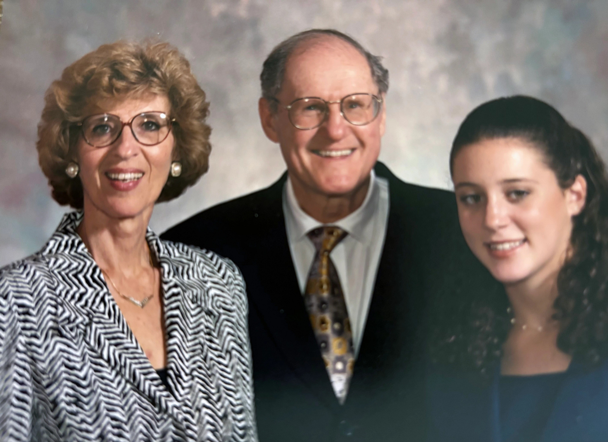 A photo shows Rachel Azaroff and her grandparents in 1997