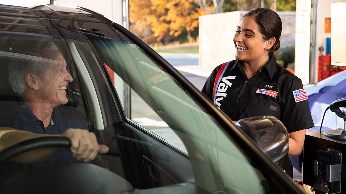 Valvoline team member greeting a customer.