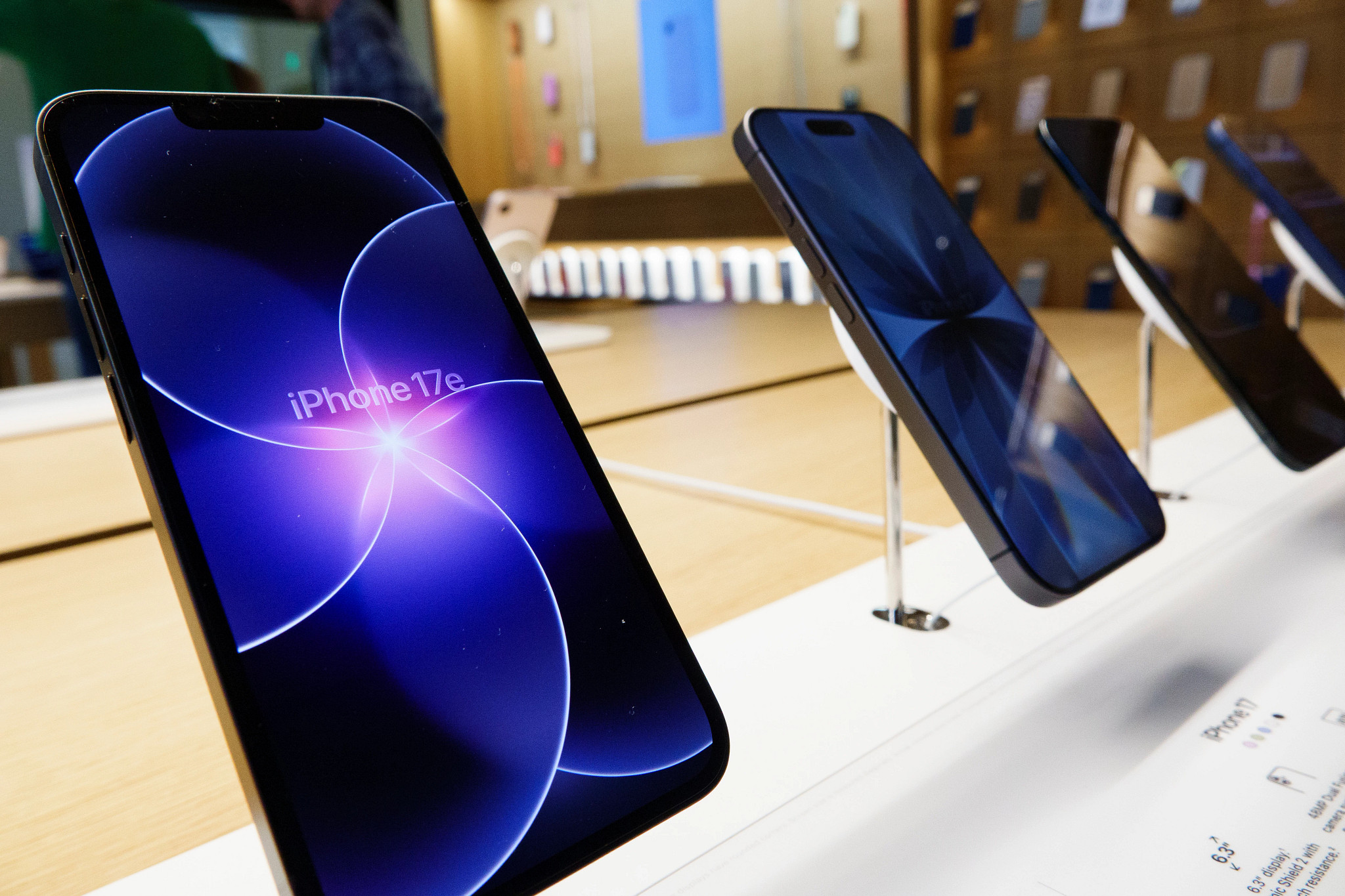 a row of iphones are shown on a display counter in a photo