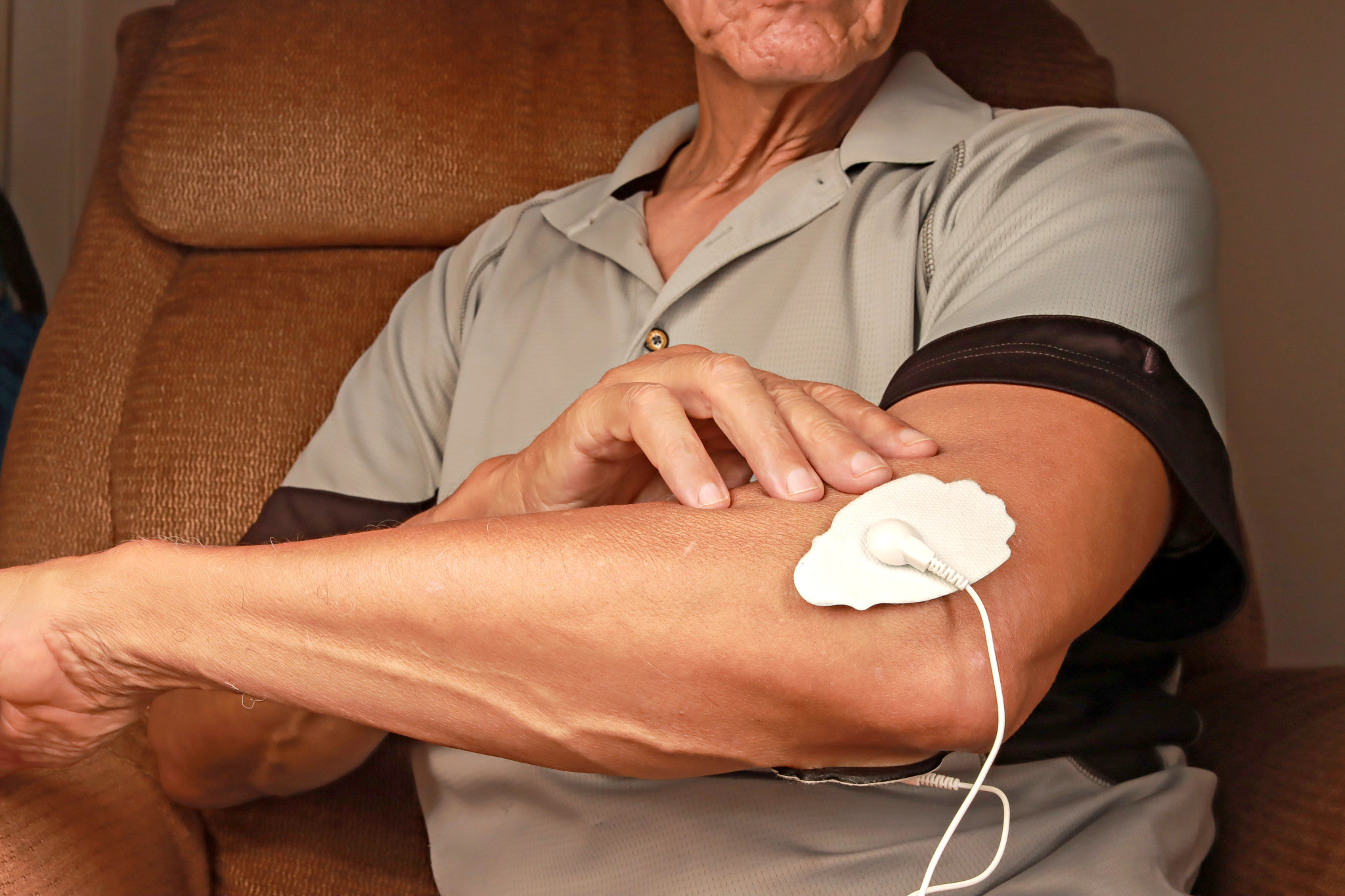 A TENS unit on an arm